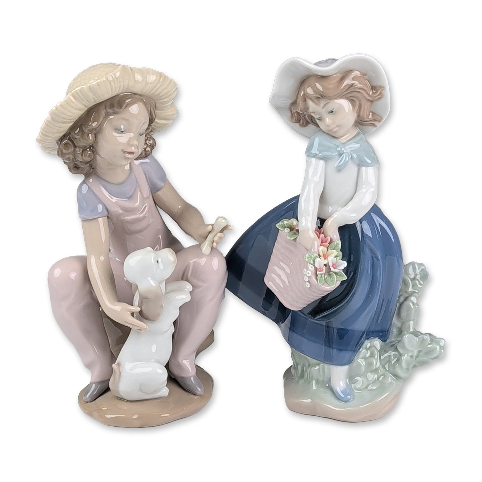Two Lladro Glazed Porcelain Figurines, Pretty Pickings 01005222 and Friends Forever 01006680: Lladro. Pair of glazed porcelain figurines featuring young girls in pastoral attire. The first figurine depicts a standing girl wearing a white hat and a blue skirt while holding a pink basket filled 