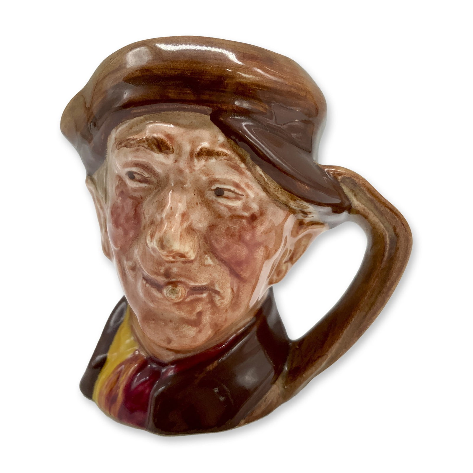 Arry D6249 - Mini - Royal Doulton Character Jug: Brown hat and coat; red and yellow scarf. Royal Doulton backstamp. Artist: Harry Fenton Dimensions: 2.25"H Date or Era: 1947 - 1960 Manufacturer or Brand: Royal Doulton Country of Origin: Eng