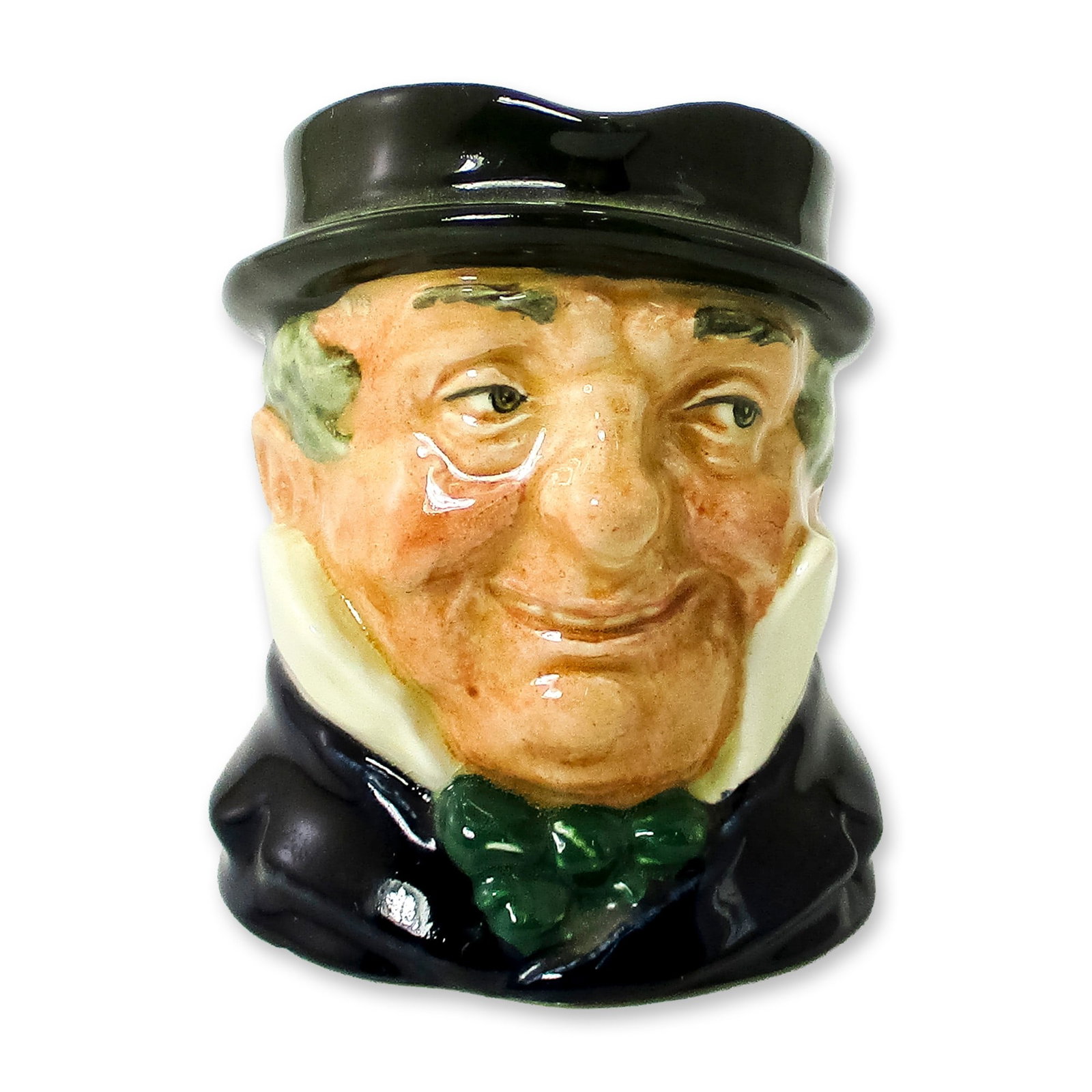 Cap'n Cuttle D5842 - Small - Royal Doulton Character Jug: Blue-black coat, light blue collar; grey-green hat; white collar; red bow tie. Royal Doulton backstamp. Artist: Leslie Harradine and Harry Fenton Dimensions: 3.5"H Date or Era: 1948 - 1960 Manufacture