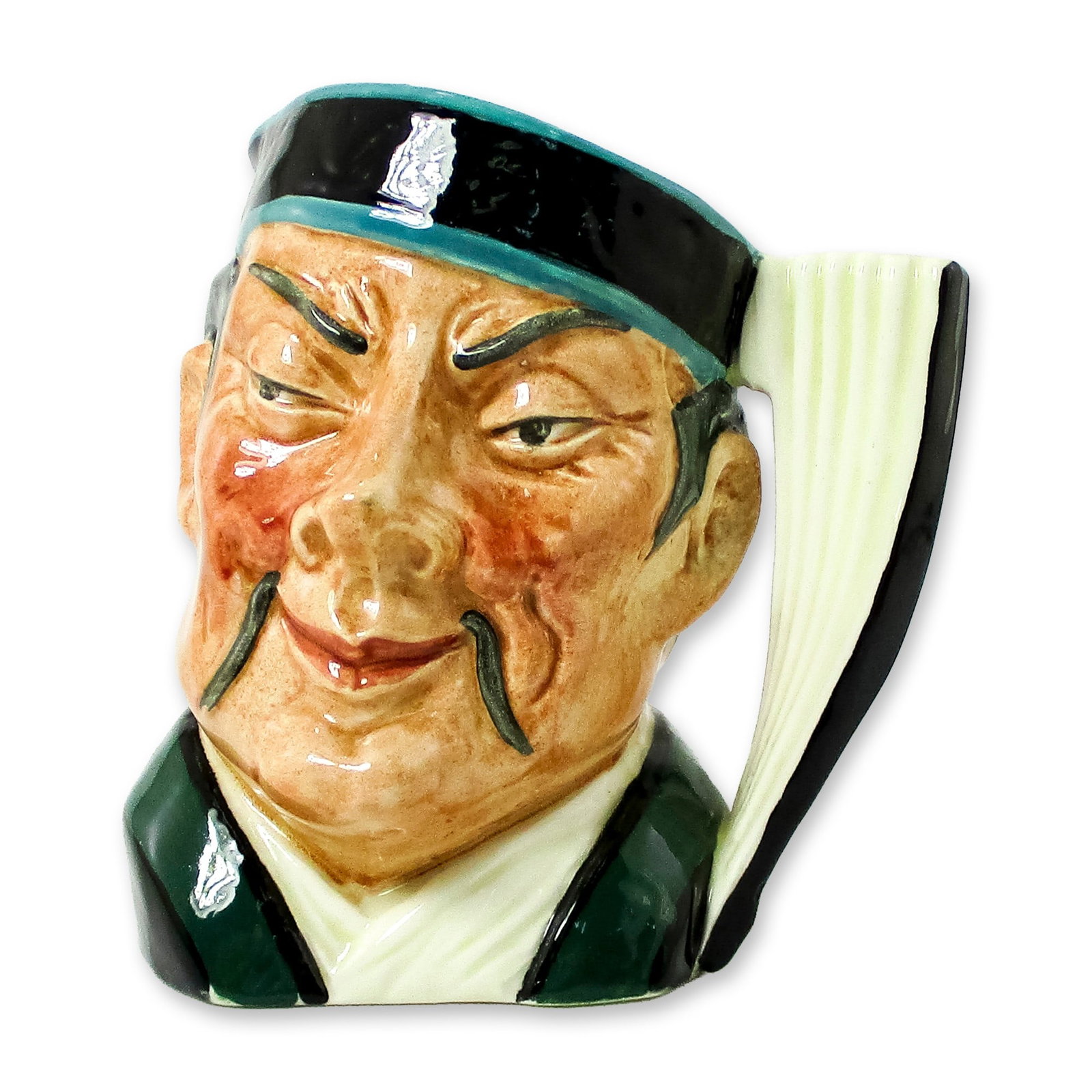 Mikado D6507 - Small - Royal Doulton Character Jug: Black and turquoise hat; green and white robes. "Mikado" is the ancient title for the emperor of Japan, beginning with the reign of the Mikado Jimmu in 660 B.C. Believed by many to have descended from