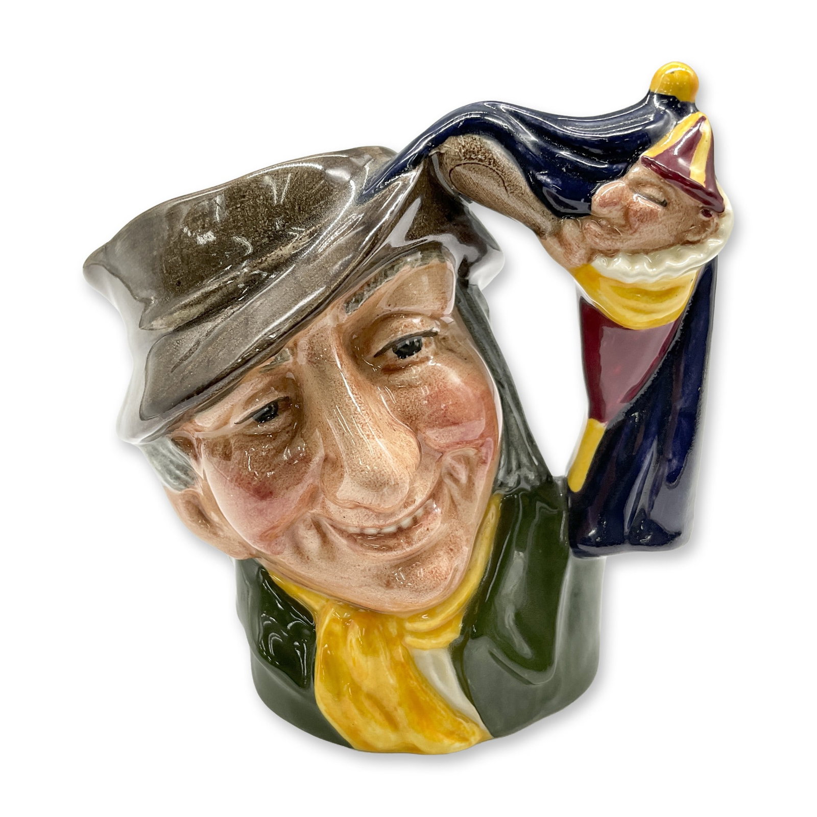 Punch and Judy Man D6593 Small Royal Doulton Character Jug: Brown hat; green coat; yellow scarf. Royal Doulton backstamp. Artist: David B. Biggs Dimensions: 3.5"H Date or Era: 1964 - 1969 Manufacturer or Brand: Royal Doulton Country of Origin: England