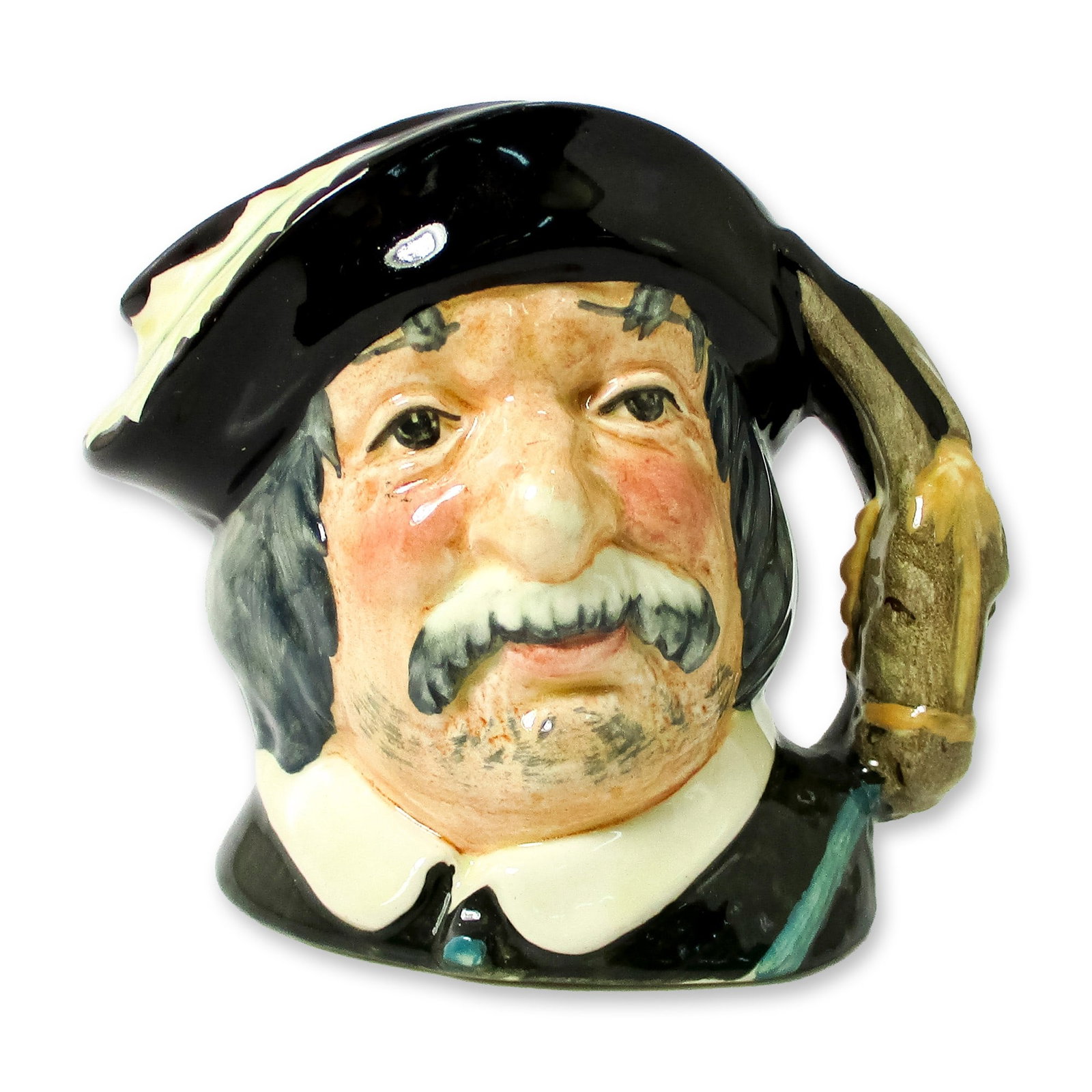 Sancho Panca D6461 - Small - Royal Doulton Character Jug: Black hat with a white feather; black coat with a white collar. Series: Characters From Literature. Royal Doulton backstamp. Artist: Geoff Blower Dimensions: 3.25"H Date or Era: 1957 - 1983 Manufactur