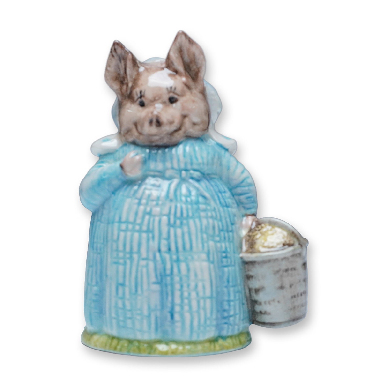 Royal Albert Beatrix Potter Aunt Pettitoes Figurine: A delightful Royal Albert porcelain figurine of Aunt Pettitoes, the charming pig character from Beatrix Potter's beloved tales. This finely crafted figurine features Aunt Pettitoes in a textured blue 