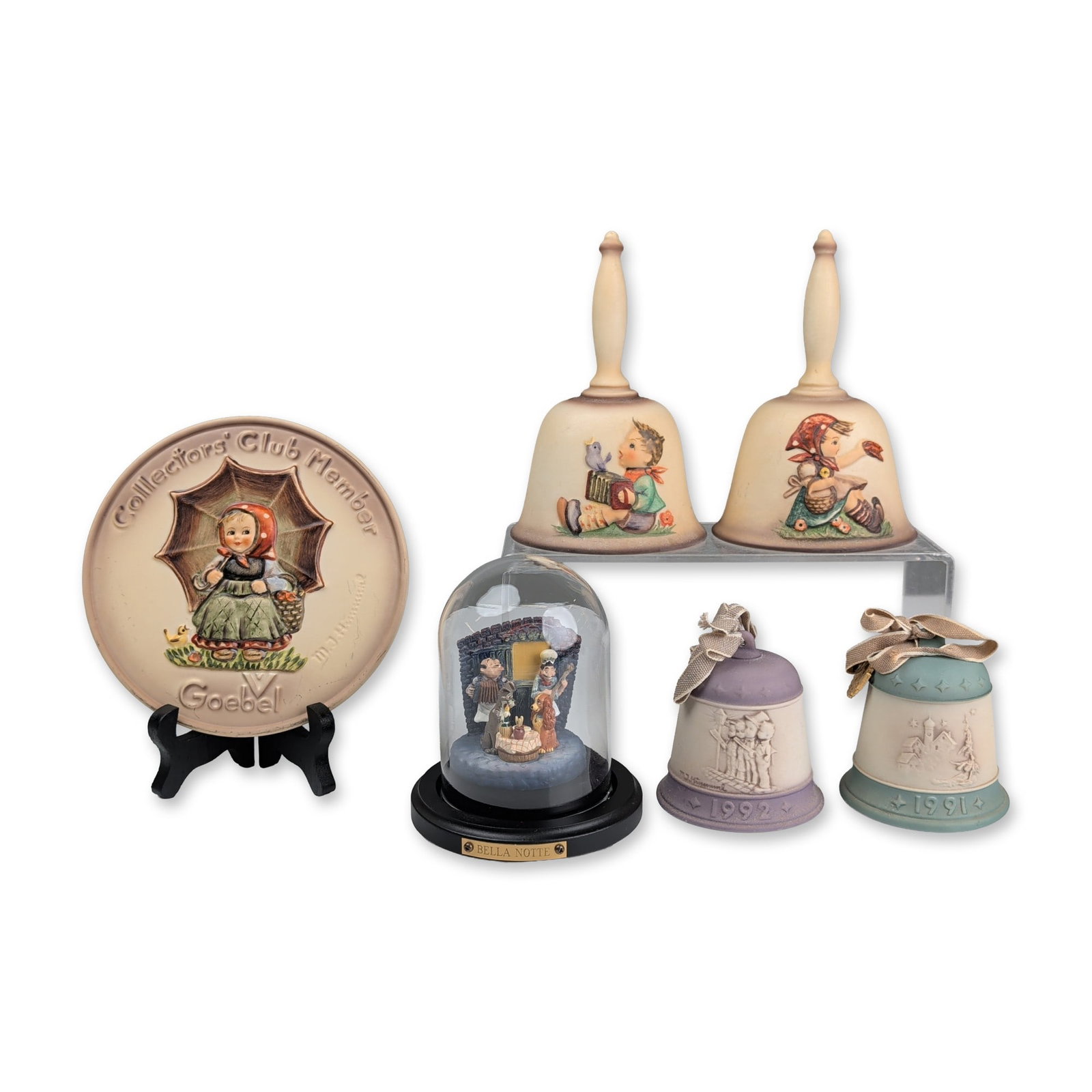 6pc Goebel Hummel and Disneyana Porcelain Ornaments, Plate, Hand Bells & Lady and The Tramp Bella: Collection of Goebel porcelain and mixed-media decorative items. Includes a 1978 Goebel Collectors Club member relief plate, Hum 690, Exclusive Special Edition No. 2, depicting a girl with an umbrella
