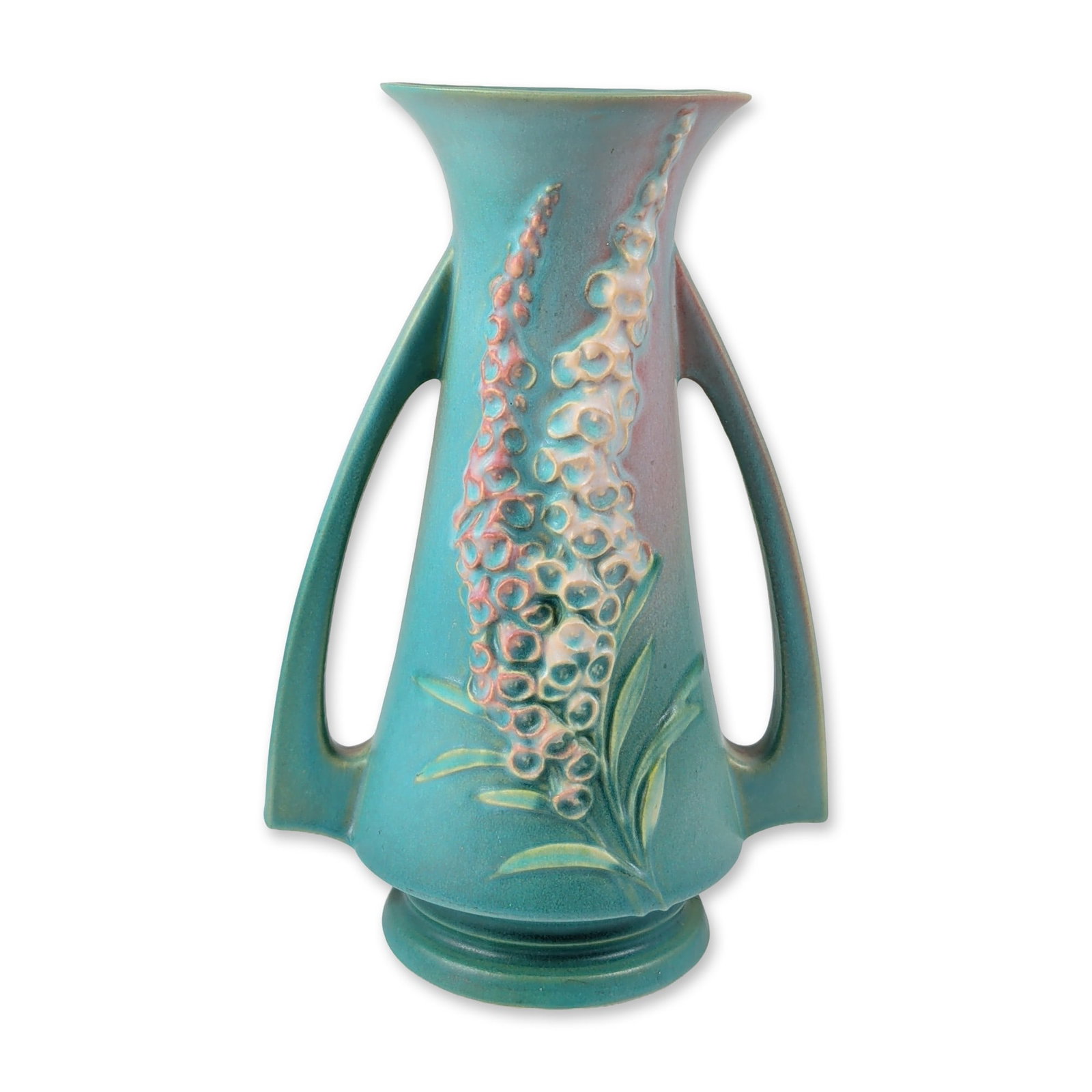 Roseville Pottery Foxglove Pattern Two-Handled Ceramic Vase: Roseville Pottery Foxglove pattern vase produced in the United States, circa 1942. Flared earthenware form featuring a teal-green matte glaze with a pink blush at the rim and handles. Relief decoratio