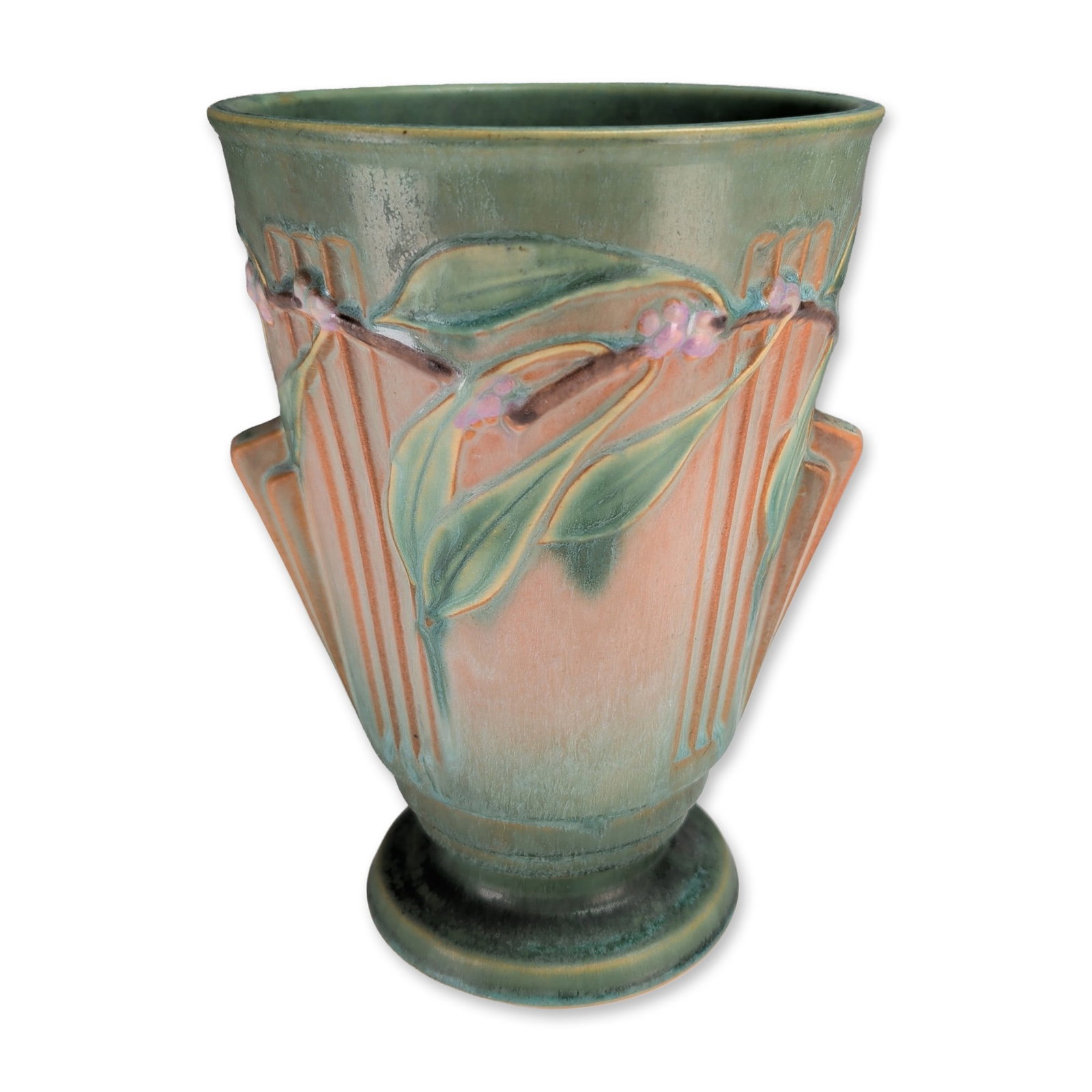 Style of Roseville Laurel Matte Glaze Pottery Vase: Roseville Laurel style art pottery vase in a tapered form with a flared rim and circular pedestal base. The body features relief-molded stylized laurel leaves and berry clusters over a background of v