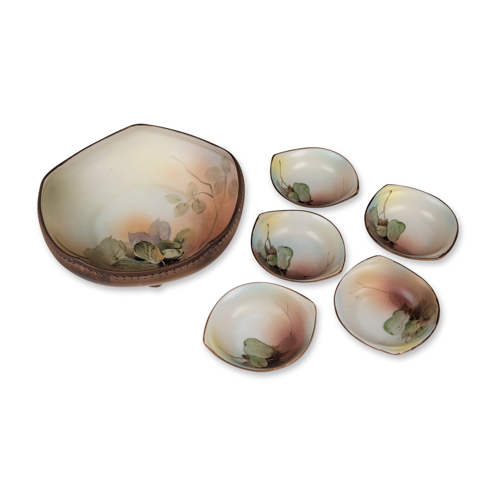 6pc Morimura Brothers Nippon Porcelain Nut Dish Set: Nippon porcelain nut set comprising a footed master bowl and five individual dishes. The porcelain forms feature a tri-lobed shape decorated with hand-painted botanical seed pod motifs in an autumnal 