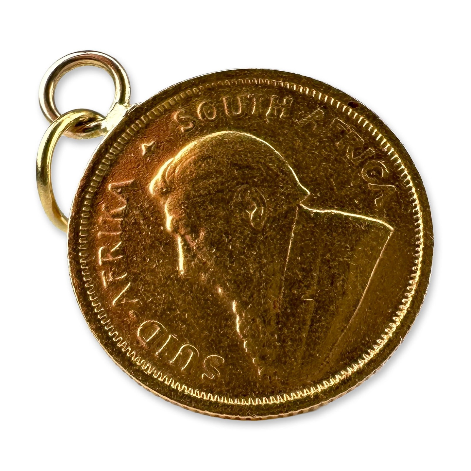 South African 1982 1/10 Oz Gold Krugerrand Pendant: South African, 1982. 1/10 ounce Krugerrand coin pendant struck in 22 karat gold, featuring the profile of Paul Kruger on the obverse and a springbok antelope on the reverse. The coin is fitted with a 