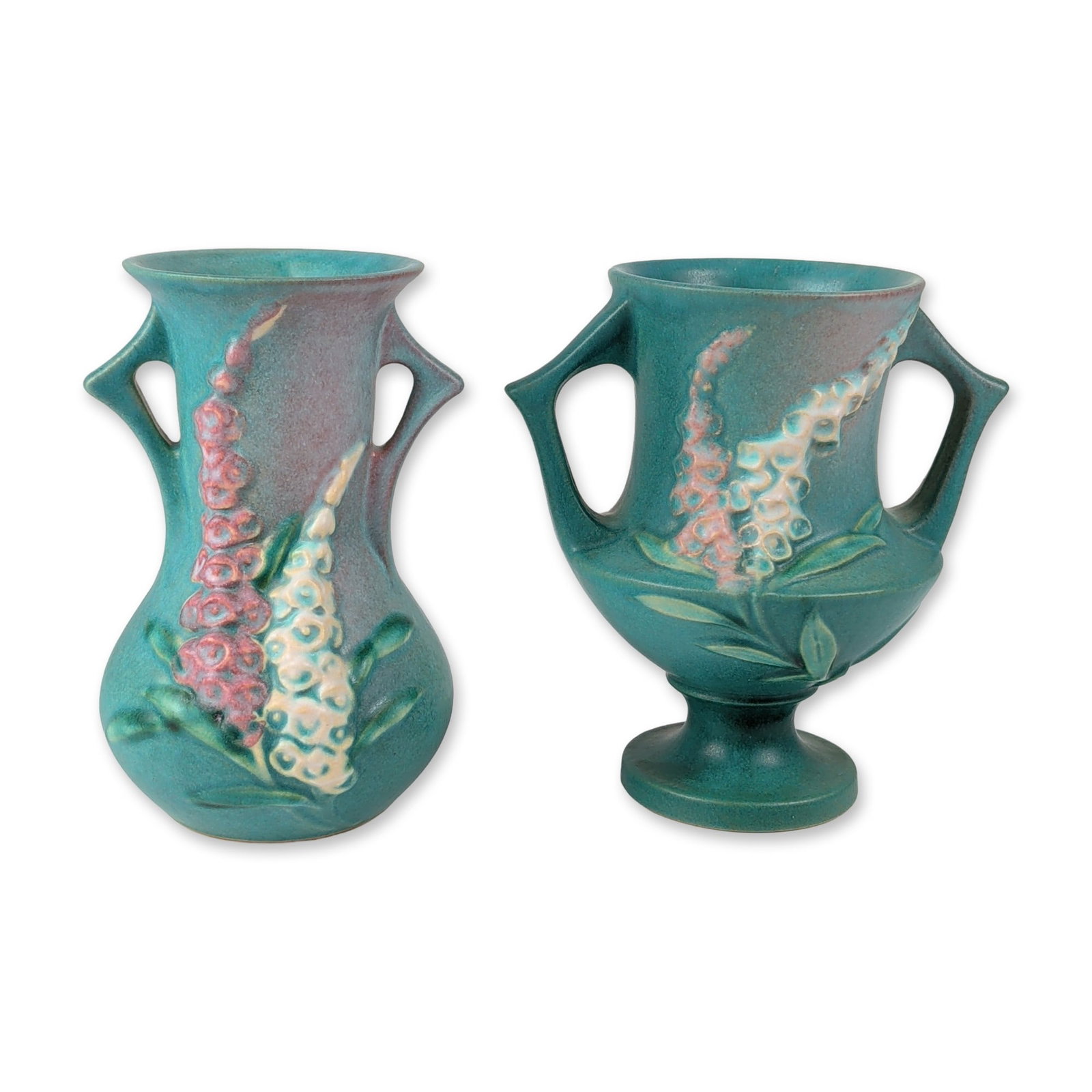 2pc Roseville Foxglove Art Pottery Vases: Roseville Pottery Company American art pottery pair of vases in the Foxglove pattern, introduced in 1942. The earthenware pieces feature relief-molded decoration of tall foxglove flower spikes finishe