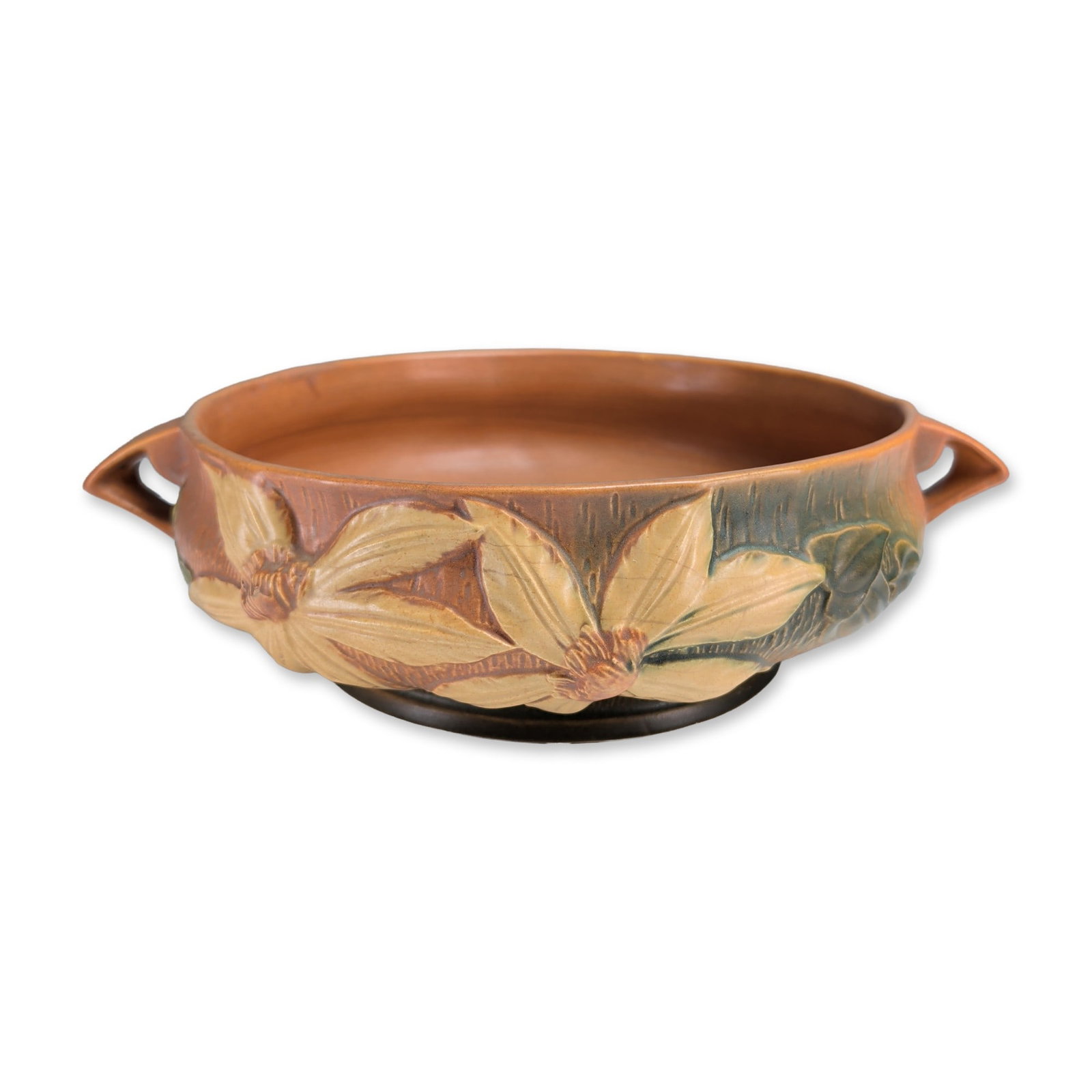 Roseville Pottery Double-Handled Console Bowl, Clematis: The shallow oval form features a textured background with a wood-grain finish in a gradient of brown, ochre, and dark green. Decoration consists of molded high-relief blossoms with six yellow petals