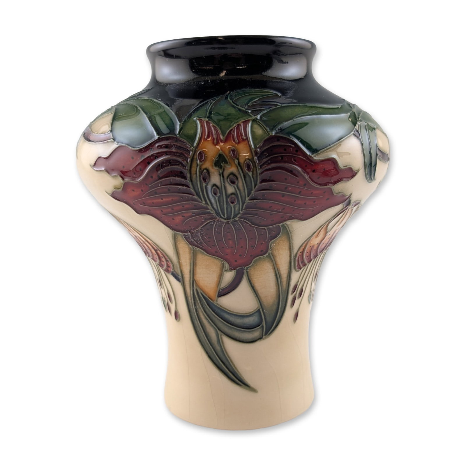Moorcroft Anna Lily Pattern Art Pottery Vase: Moorcroft Anna Lily pattern art pottery vase, designed by Nicola Slaney. This earthenware vessel features a bulbous shoulder and tapered base, decorated with tubelined stylized lilies in shades of
