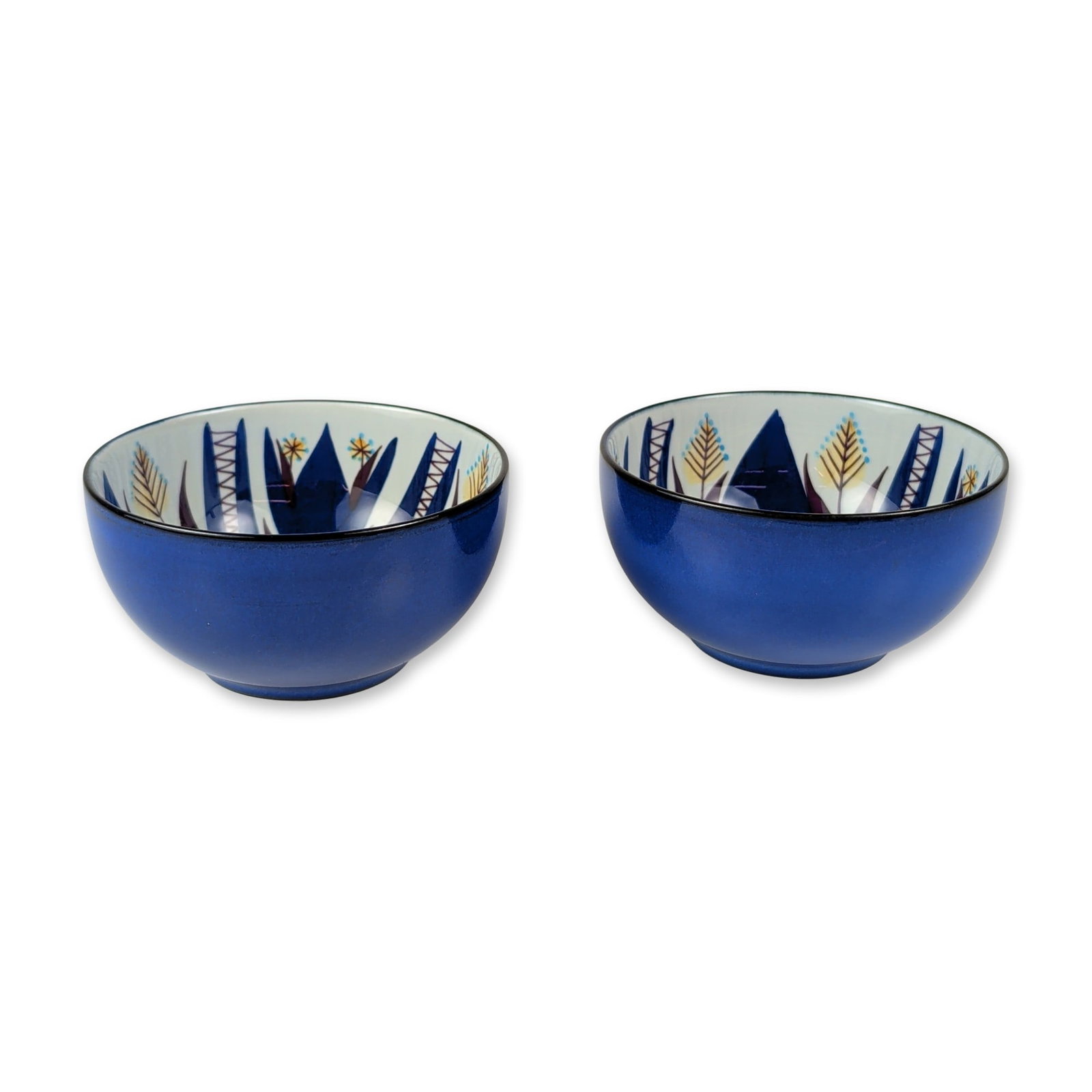2pc Royal Copenhagen Tenera Fajance Bowls: Royal Copenhagen, Denmark. Pair of small circular fajance bowls from the Tenera series, designed by Marianne Johnson. The exteriors are finished in a solid cobalt blue glaze, while the interiors