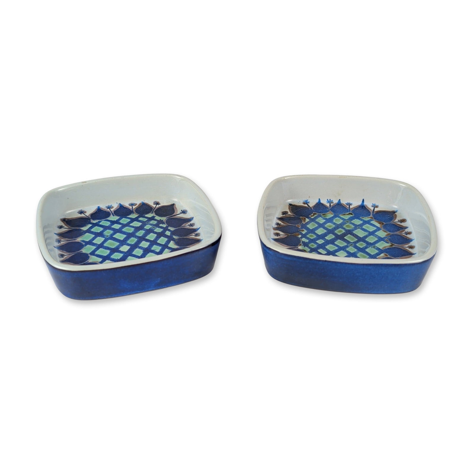 2pc Royal Copenhagen Fajance Tenera Dishes: Royal Copenhagen, Denmark. Pair of small square dishes from the Tenera series designed by Marianne Johnson. The earthenware construction featuring a mid-century modern stylized floral motif with a