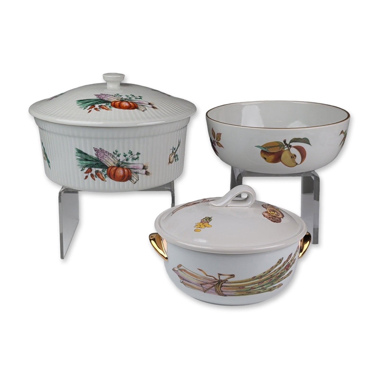Three Royal Worcester and Apilco Porcelain Servers: Royal Worcester and Apilco. Trio of serving pieces in fine porcelain, featuring the Evesham fruit pattern and vegetable transfer motifs. The grouping includes a large Apilco ribbed covered casserole, 