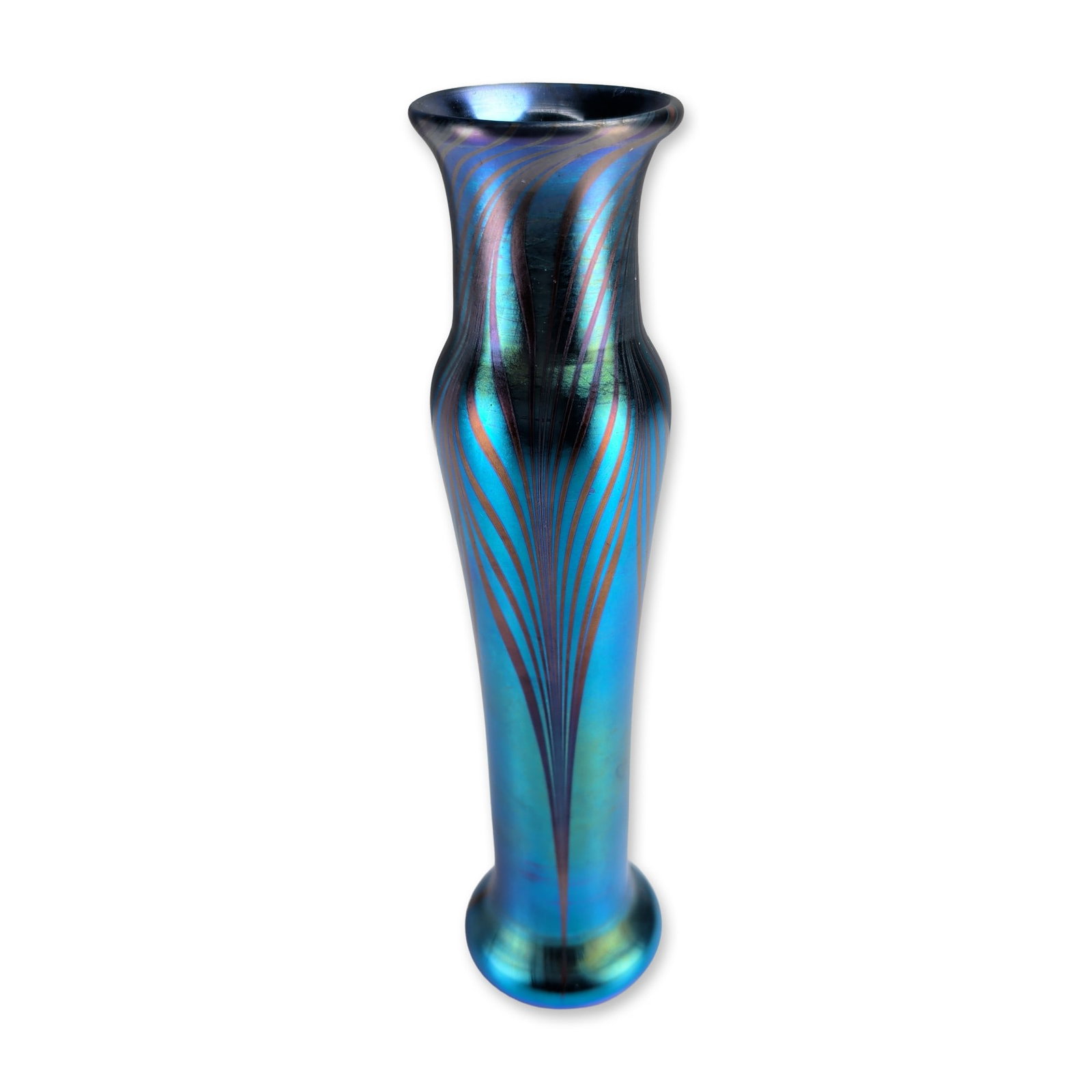Orient and Flume Iridescent Pulled Feather Glass Vase: Orient and Flume contemporary studio glass vase, hand-blown in an iridescent glass form featuring a slender neck, flared rim, and weighted circular base. The exterior is finished in a peacock-blue lus