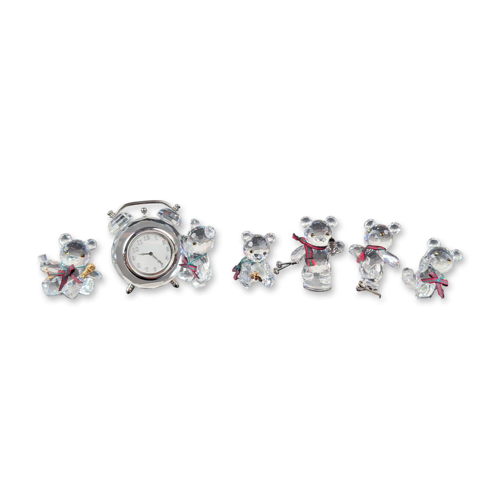 6pc Swarovski Silver Crystal Kris Bear Figurine Collection: Collection of six Swarovski faceted lead crystal figurines from the Kris Bear series. Each figure features a red and green tartan fabric ribbon. The group includes various thematic variations: a stand