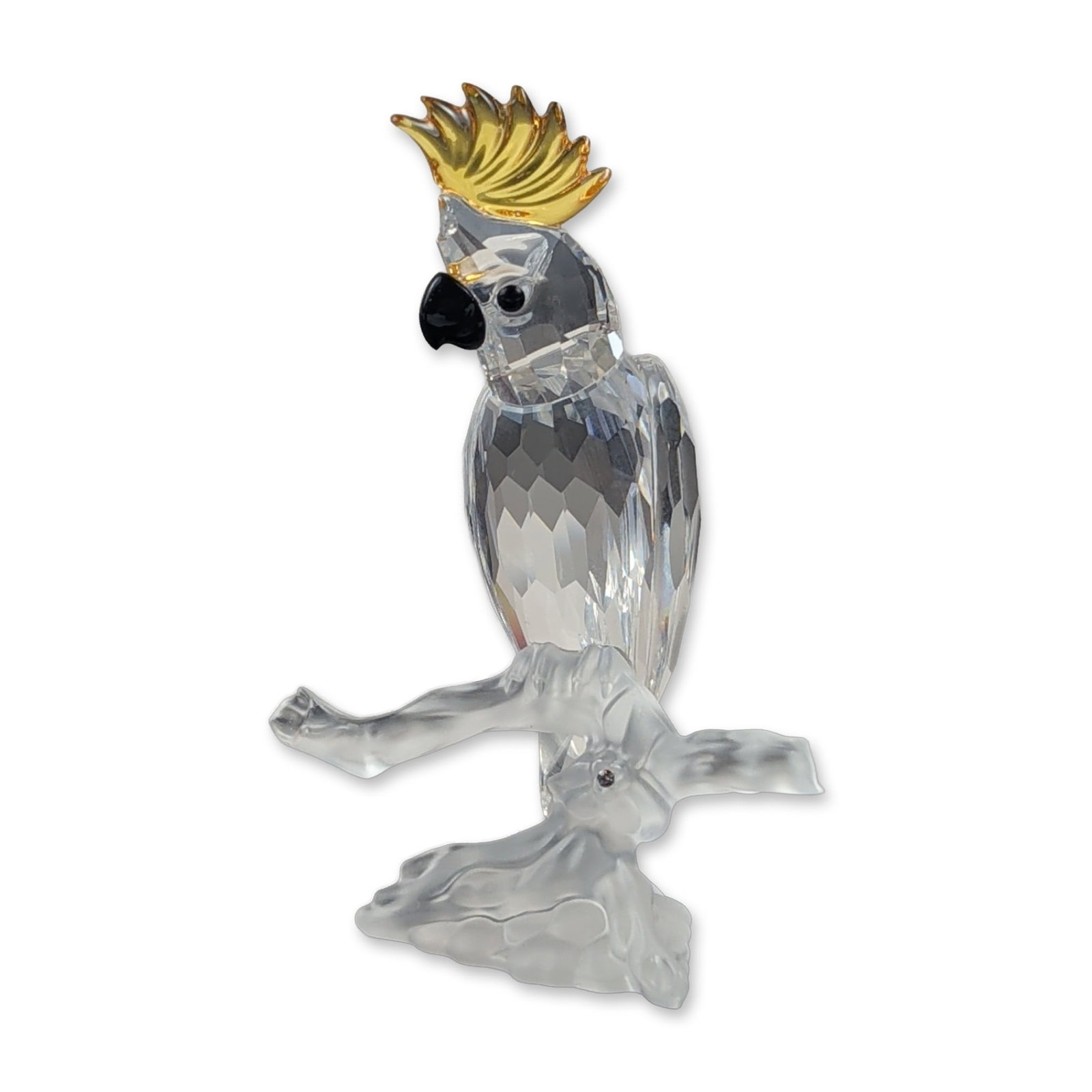 Swarovski Silver Crystal Cockatoo Figurine: Swarovski Silver Crystal cockatoo figurine, model number 261635, featuring a clear faceted crystal body with a black crystal beak and eyes. The bird is adorned with a yellow-tinted crystal crest and i