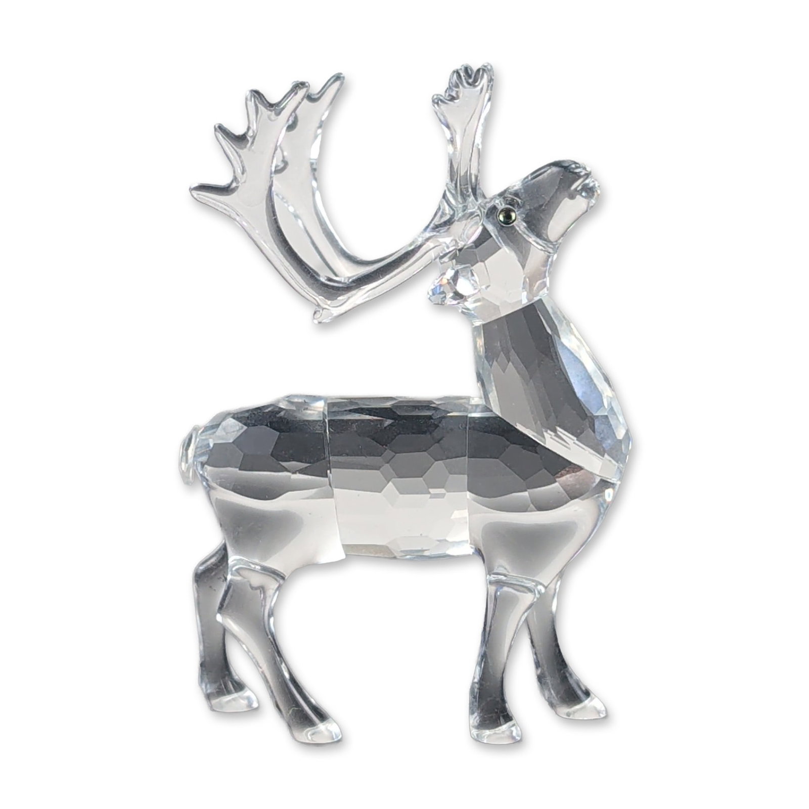 Swarovski Silver Crystal Reindeer Figurine: This festive standing reindeer figurine from the Swarovski Silver Crystal collection is crafted from premium clear Austrian lead crystal. The modern holiday subject features a multi-faceted torso, nec
