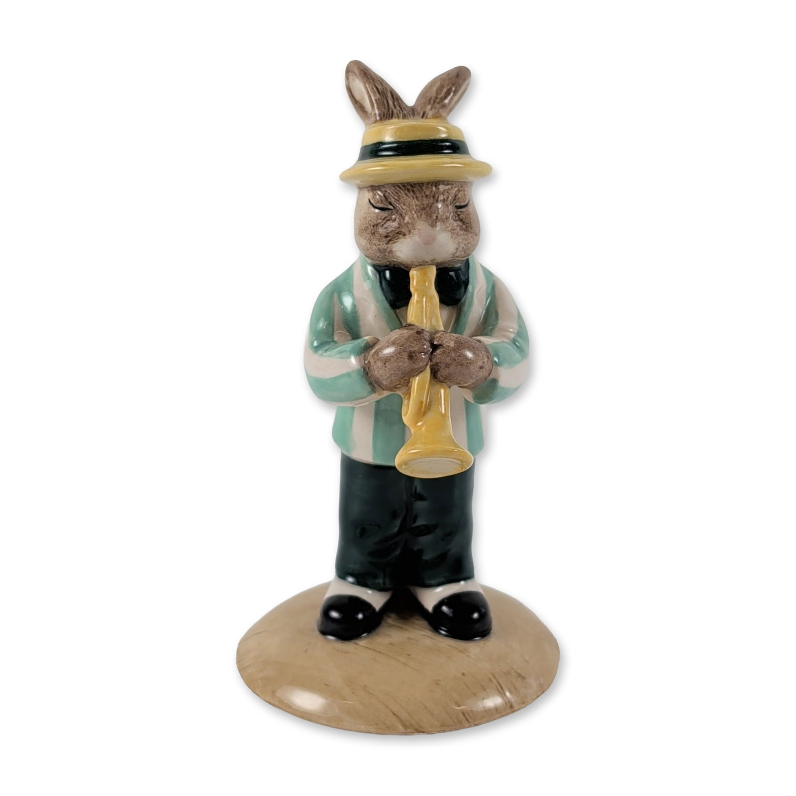 Royal Doulton Trumpet Player Bunnykins Figurine: Royal Doulton glazed ceramic figurine, Trumpet Player Bunnykins (DB 210), from the Jazz Band collection. The musician is modeled as an anthropomorphic rabbit wearing a green and white striped blazer, 