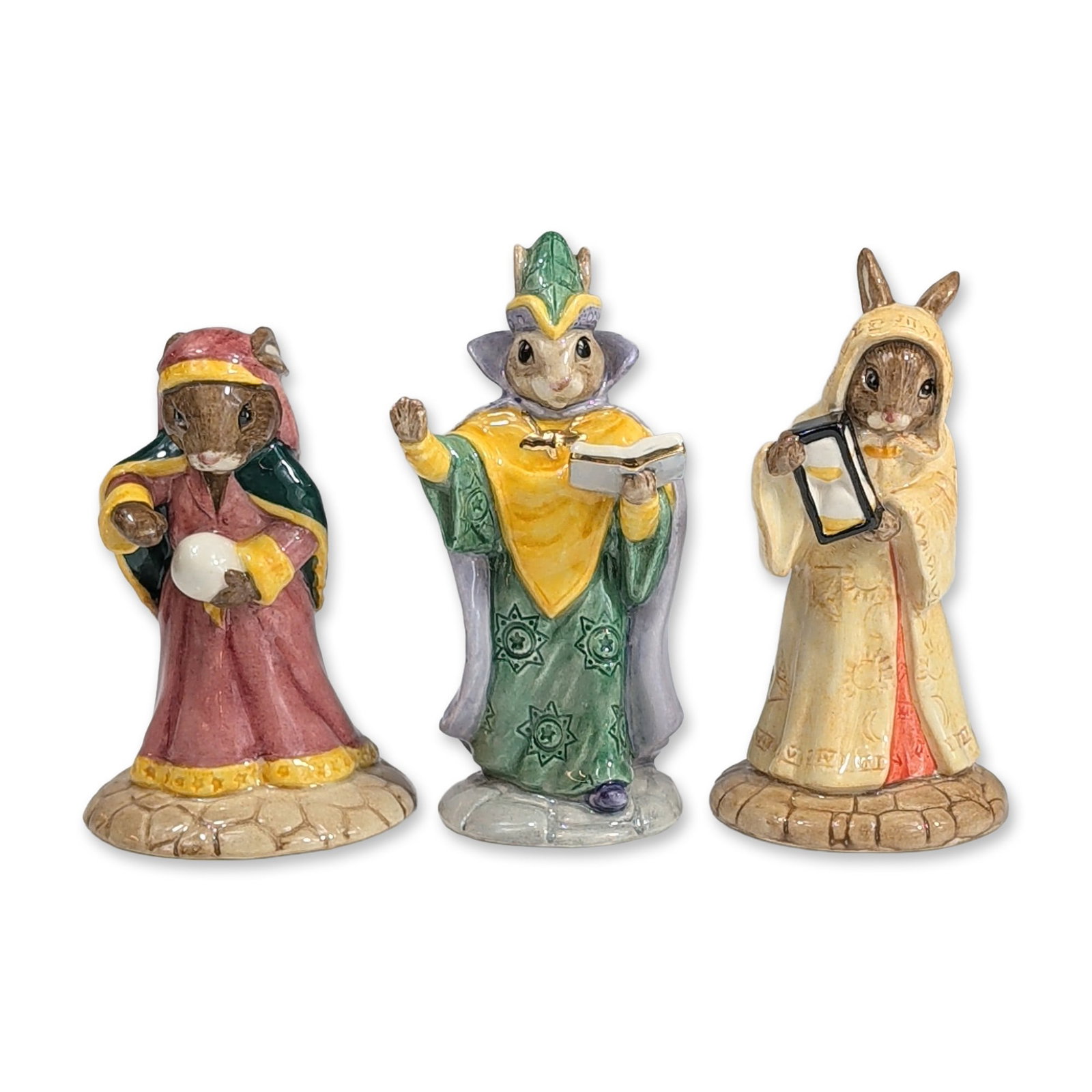 3pc Royal Doulton Mystical Bunnykins Figurines: Trio of Royal Doulton Bunnykins figurines from the mystical collection in hand-painted glazed ceramic. The group includes Sands of Time (DB 229), depicting a rabbit in tan robes holding an hourglass; 