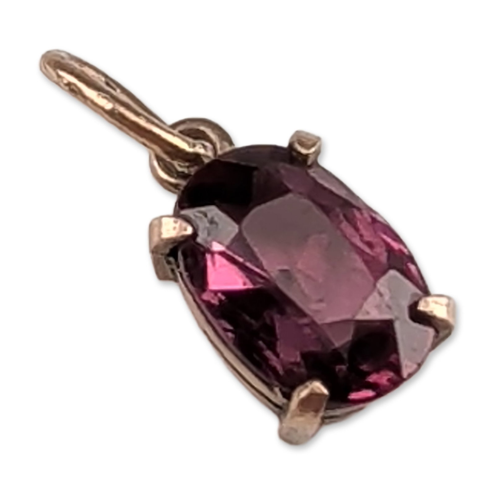 8K Gold Reddish Purple Garnet Pendant Charm: Vintage 8K gold pendant charm featuring an oval-faceted reddish-purple garnet in a four-prong basket setting. The setting is constructed with an open back and a fixed oval bail. Tested with Thermo