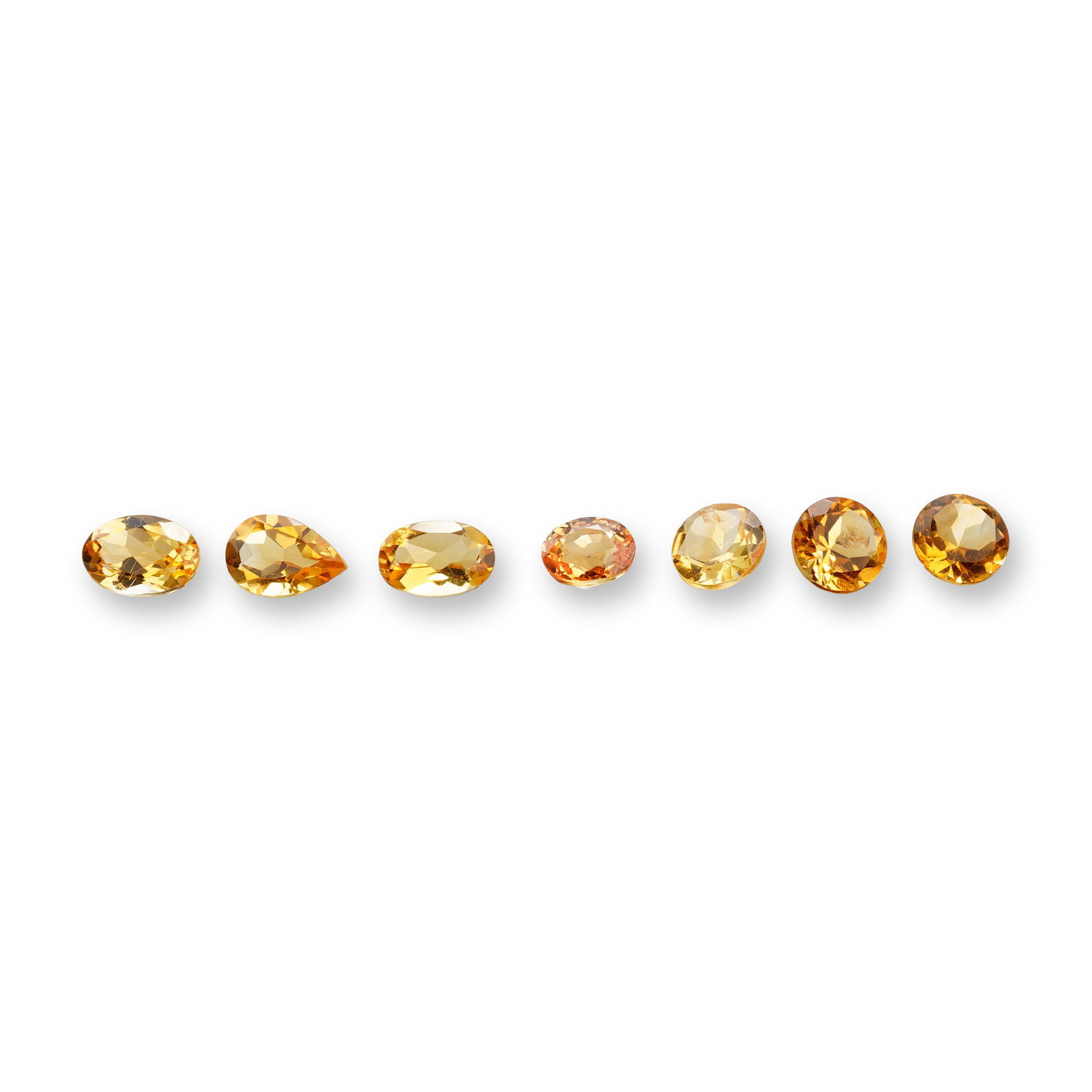 7pc Citrine Gemstones in Various Shapes: Set of 7 Citrine stones. Citrine is a sunny, golden variety of quartz prized for manifesting abundance, boosting self-confidence, and clearing negative energy. Often called the "Merchant's Stone," it