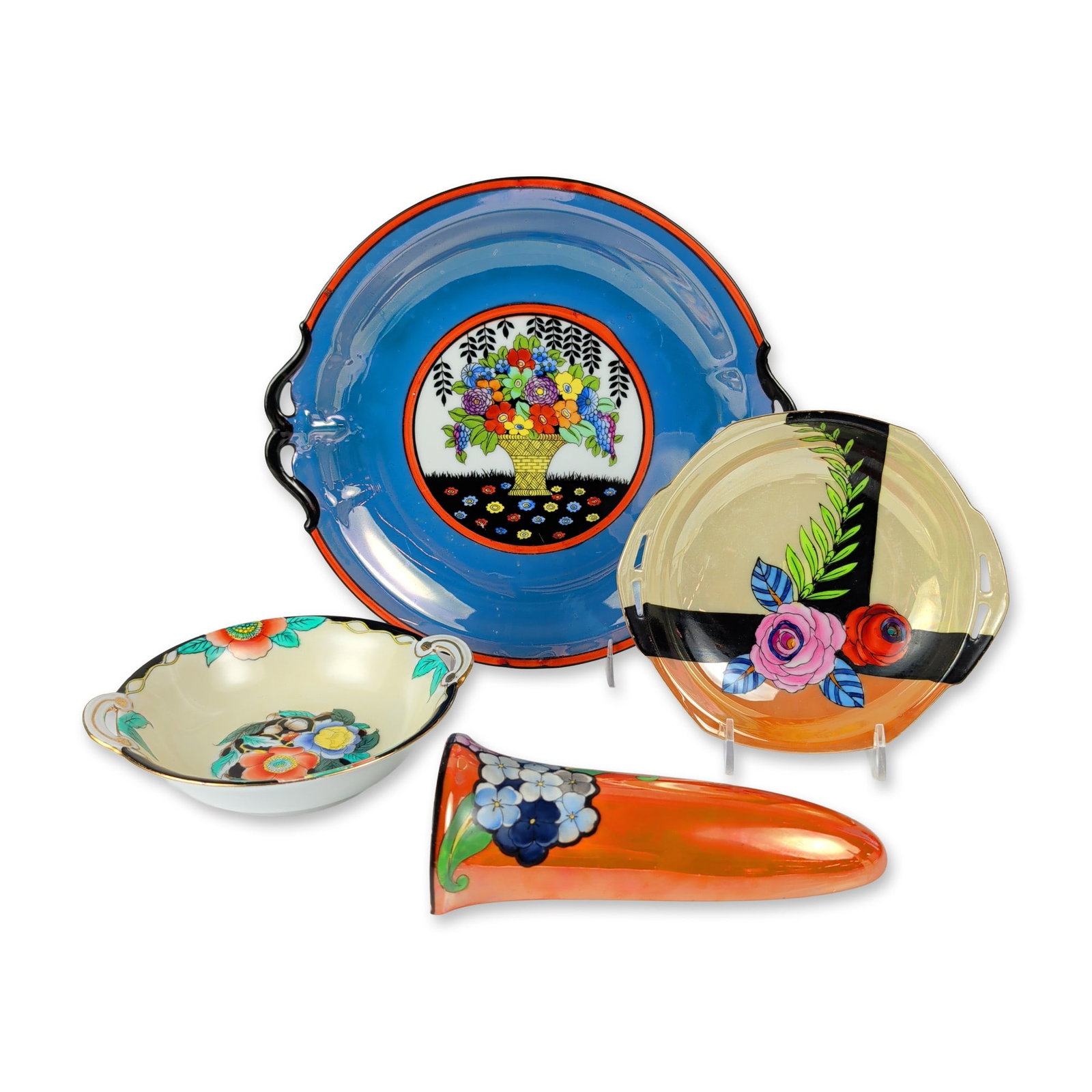 4pc Noritake Japanese Art Deco Porcelain Bowls and Wall Pocket: The group includes a round tray with pierced handles featuring a central floral basket medallion and cobalt blue border; a small circular plate with geometric rose decoration; a small handled bowl wit
