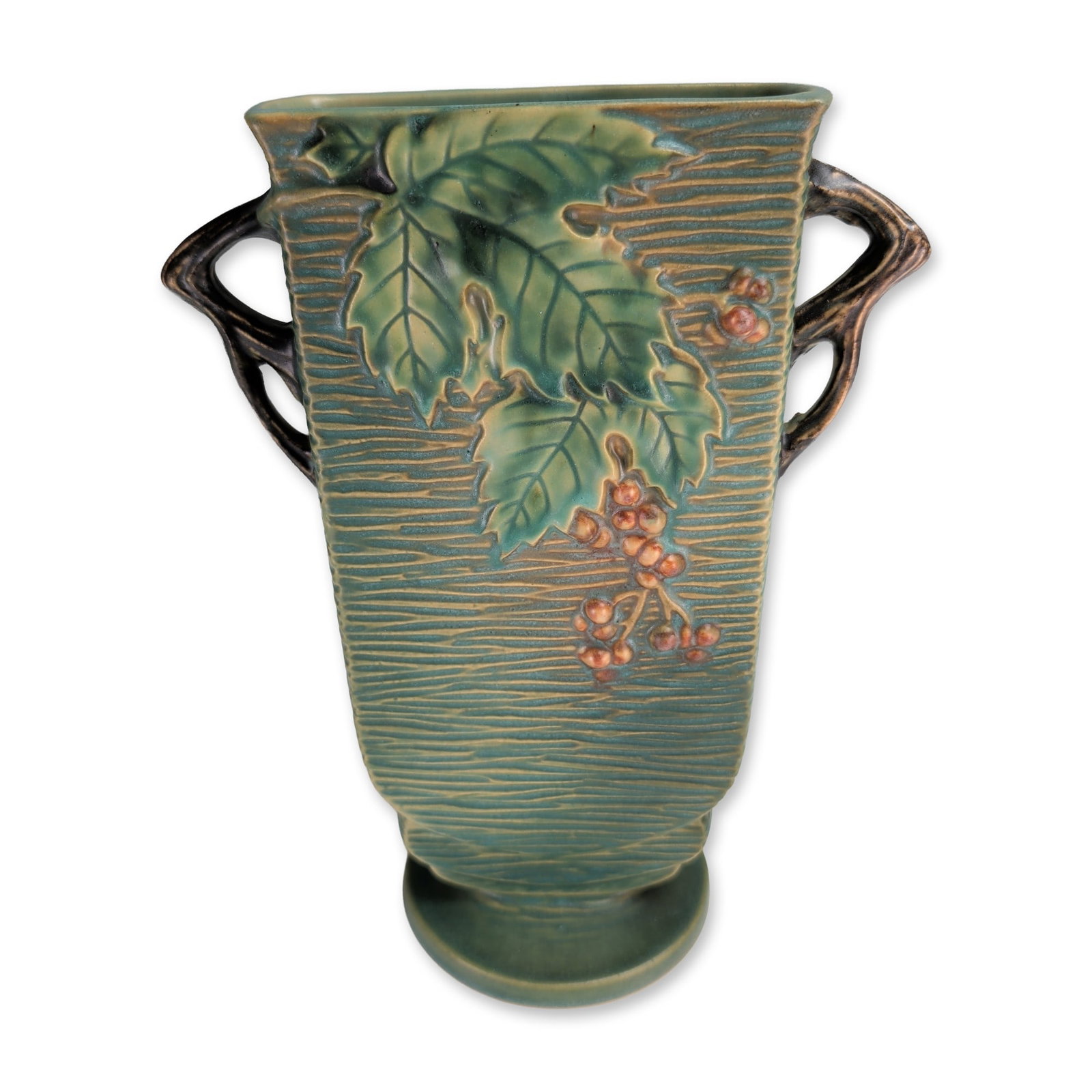 Roseville Bushberry Green Pottery Vase: Roseville Pottery bushberry pattern vase in glazed earthenware, featuring high relief bittersweet berry sprigs and foliage against a vertically textured green ground with blue accents. The rectangular