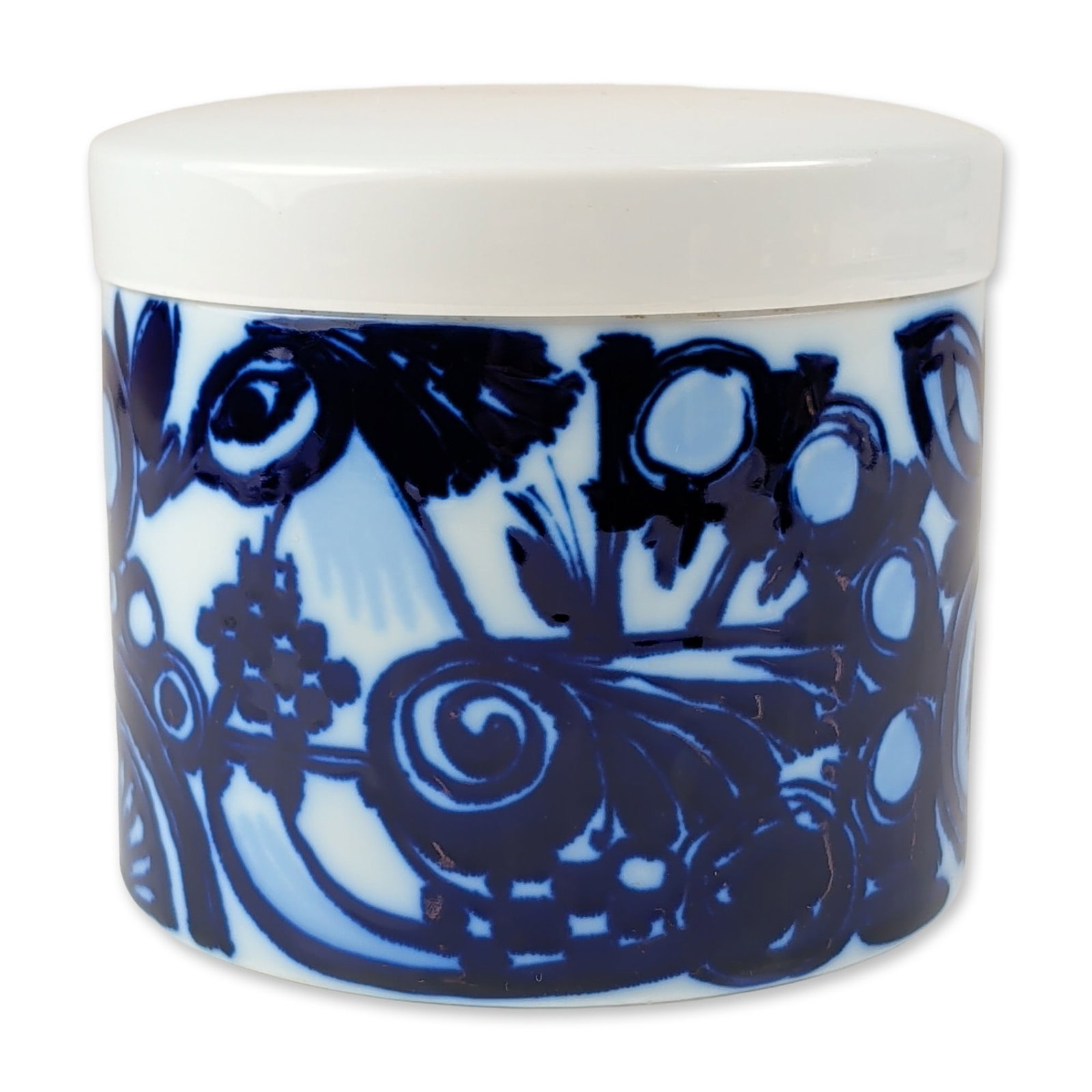 Bjorn Wiinblad for Rosenthal Porcelain Lidded Canister: Rosenthal Studio-Linie porcelain lidded canister designed by Bjorn Wiinblad, featuring stylized cobalt blue botanical and geometric decoration on a white glazed ground. The cylindrical vessel is fitte