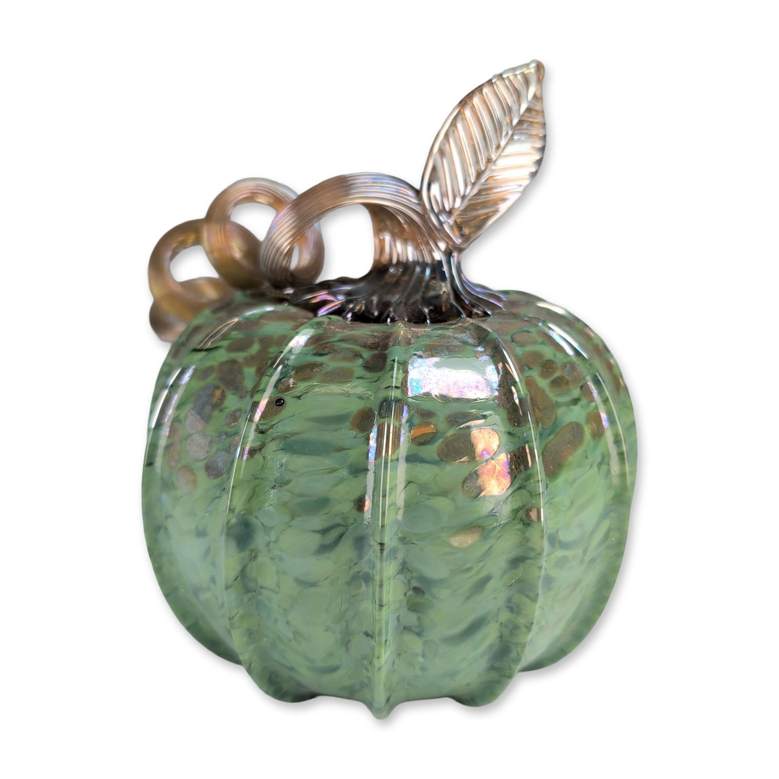 Steven Lundberg (American 1953-2008) Glass Art Pumpkin: Steven Lundberg hand blown glass art pumpkin in shades of green, featuring internal mottling, dark brownish-gold speckles, and deep vertical ribbing. The piece is topped with an applied clear glass st