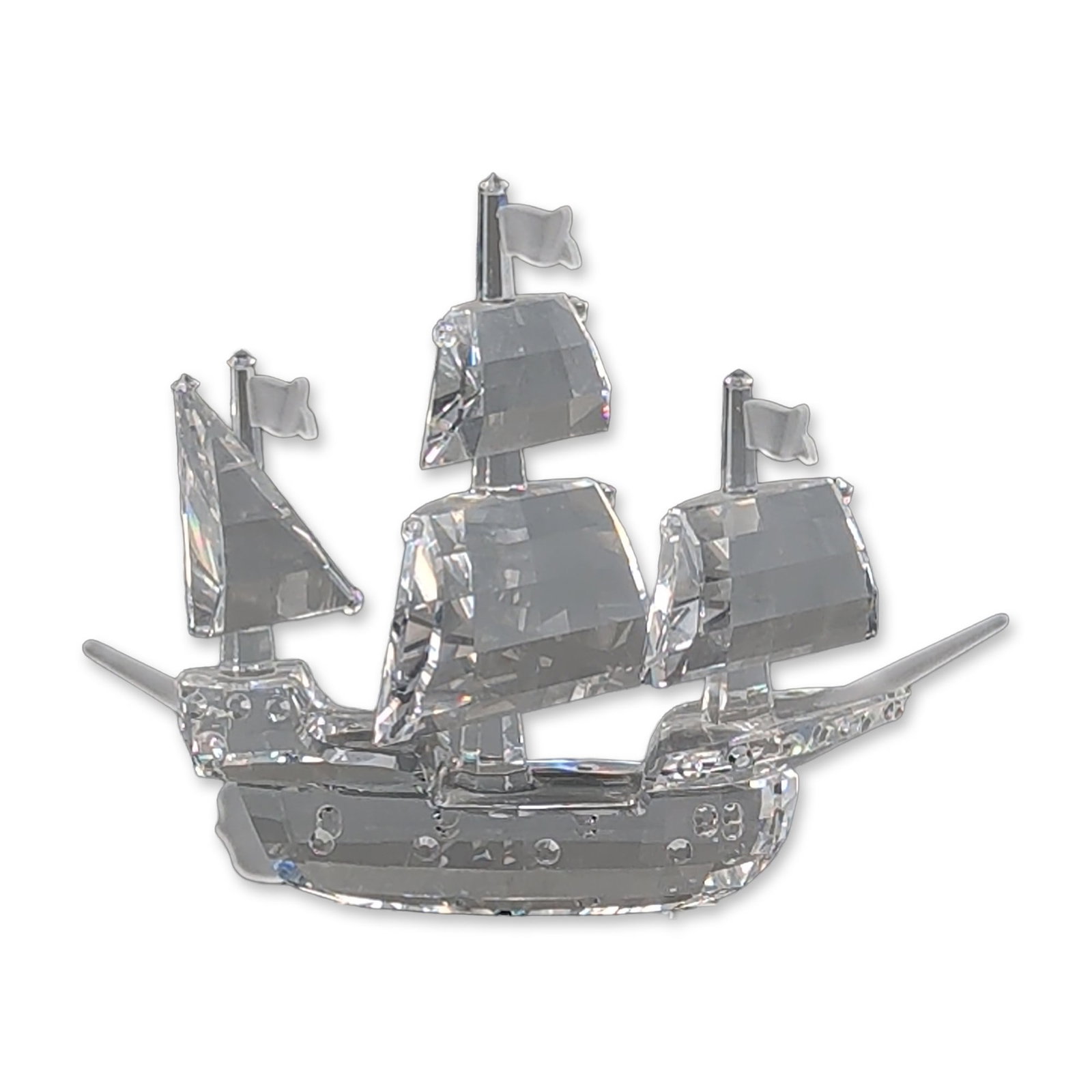 Swarovski Silver Crystal Figurine, Santa Maria Ship: Swarovski Silver Crystal figurine of the Santa Maria three-masted ship, featuring faceted lead crystal sails and hull with three vertical masts topped by frosted crystal flags. The accompanying grey o