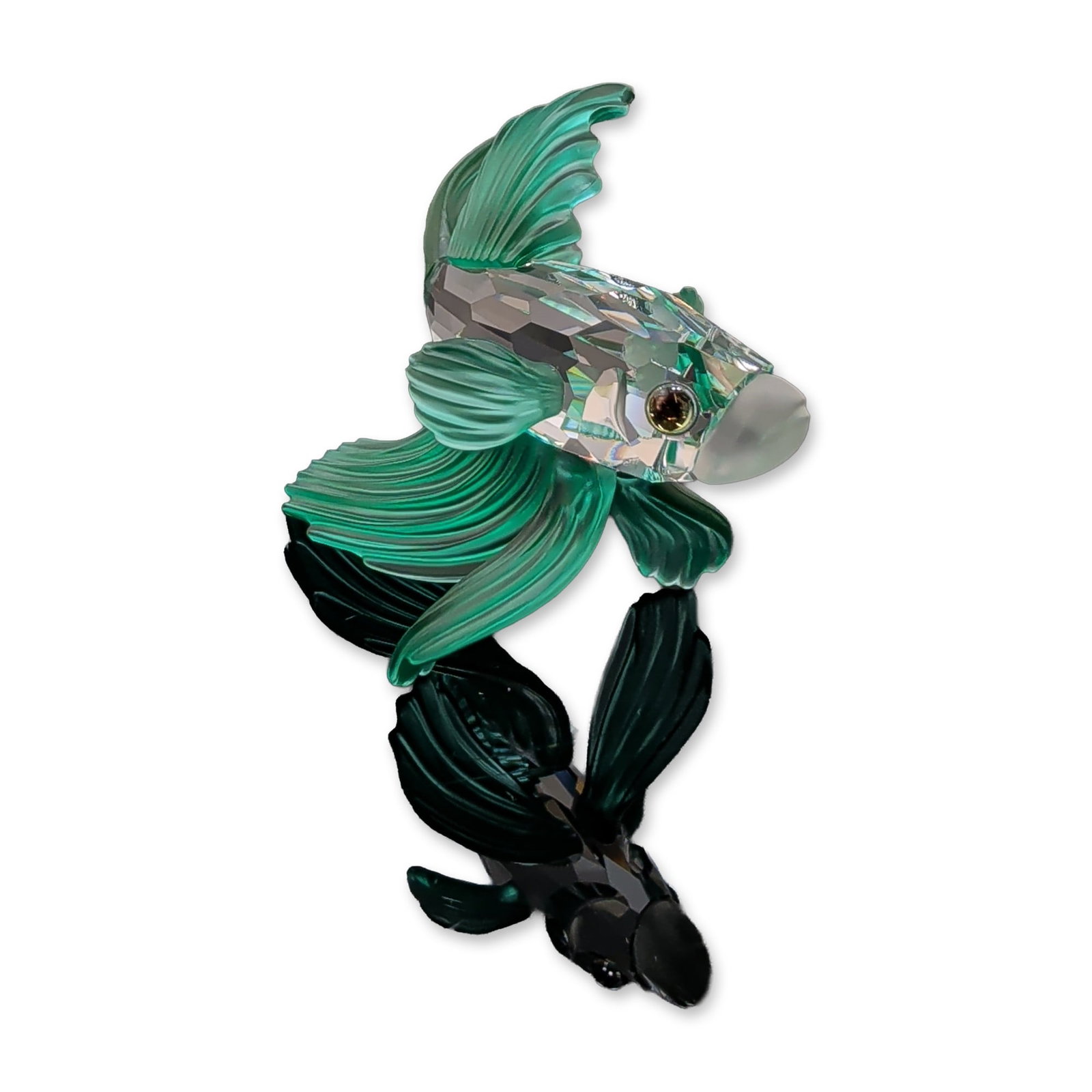 Swarovski Crystal Figurine, Green Siamese Fighting Fish: Swarovski crystal Siamese Fighting Fish figurine, also known as a Betta fish. The piece features a clear faceted lead crystal body with a frosted mouth and two melon colored crystal eyes. The prominen