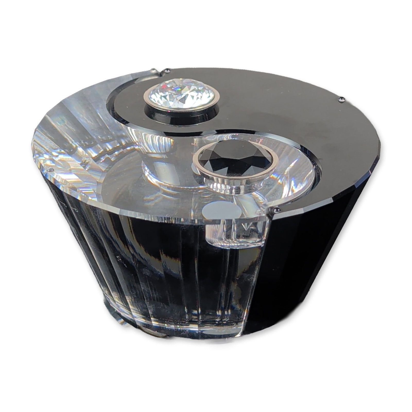 Swarovski Yin Yang Crystal Candleholders: Swarovski Selection series, designed by Tao Ho. Pair of interlocking candleholders forming a Yin-Yang symbol. One component is crafted from clear multi-faceted crystal with a black crystal circular in