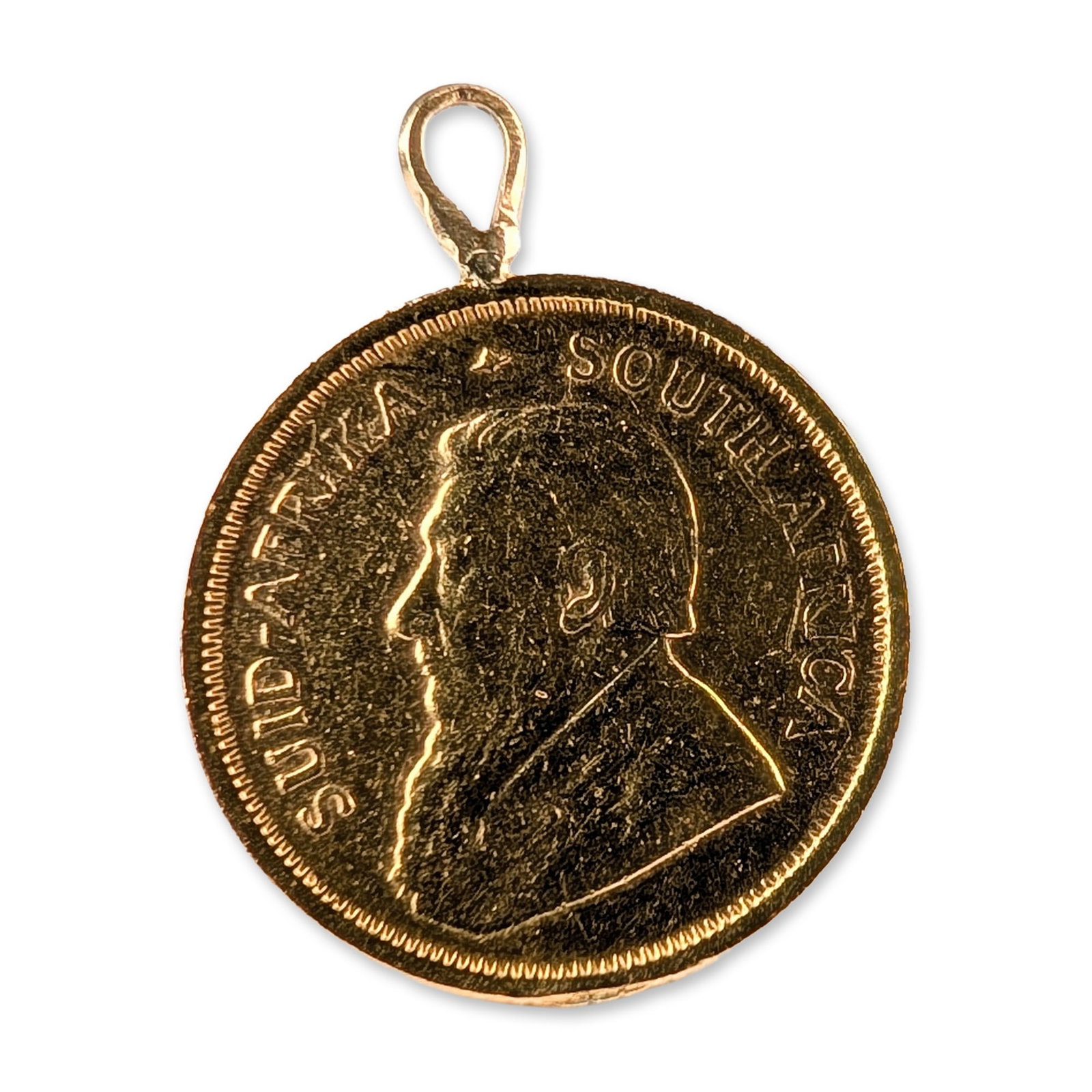 South African 1982 1/10 Oz Gold Krugerrand Pendant: South African gold coin pendant featuring a 1982 1/10 Krugerrand bullion coin. Struck in 22 karat gold, the coin is fitted with a yellow gold bail soldered to the rim at the twelve o'clock position. T