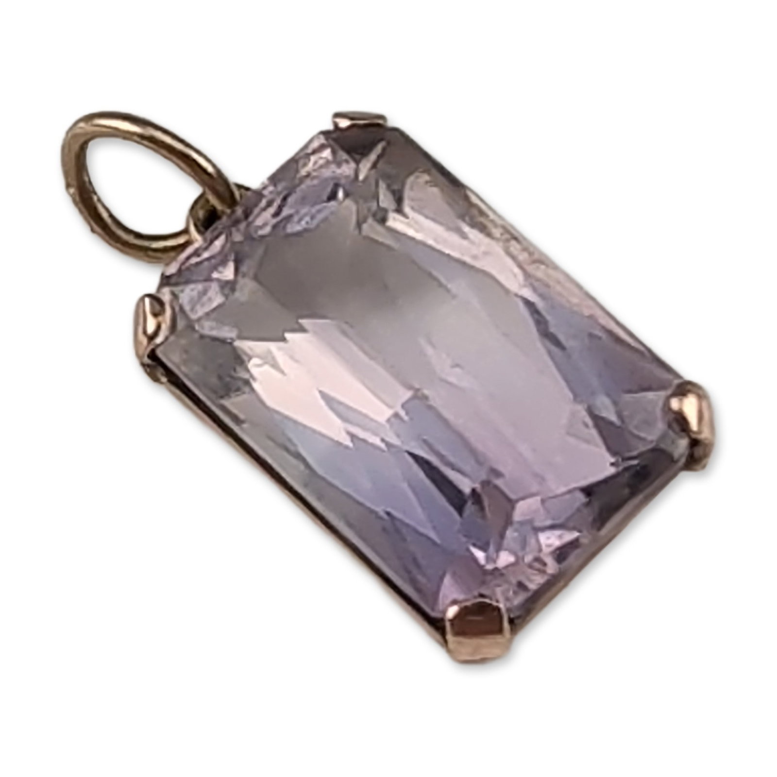 Emerald-Cut Amethyst and 8K Gold Pendant Charm: A rectangular gemstone pendant charm featuring a pale lilac emerald-cut amethyst. The stone is mounted in an 8K gold four-prong basket setting with an open back to facilitate light transmission. The s