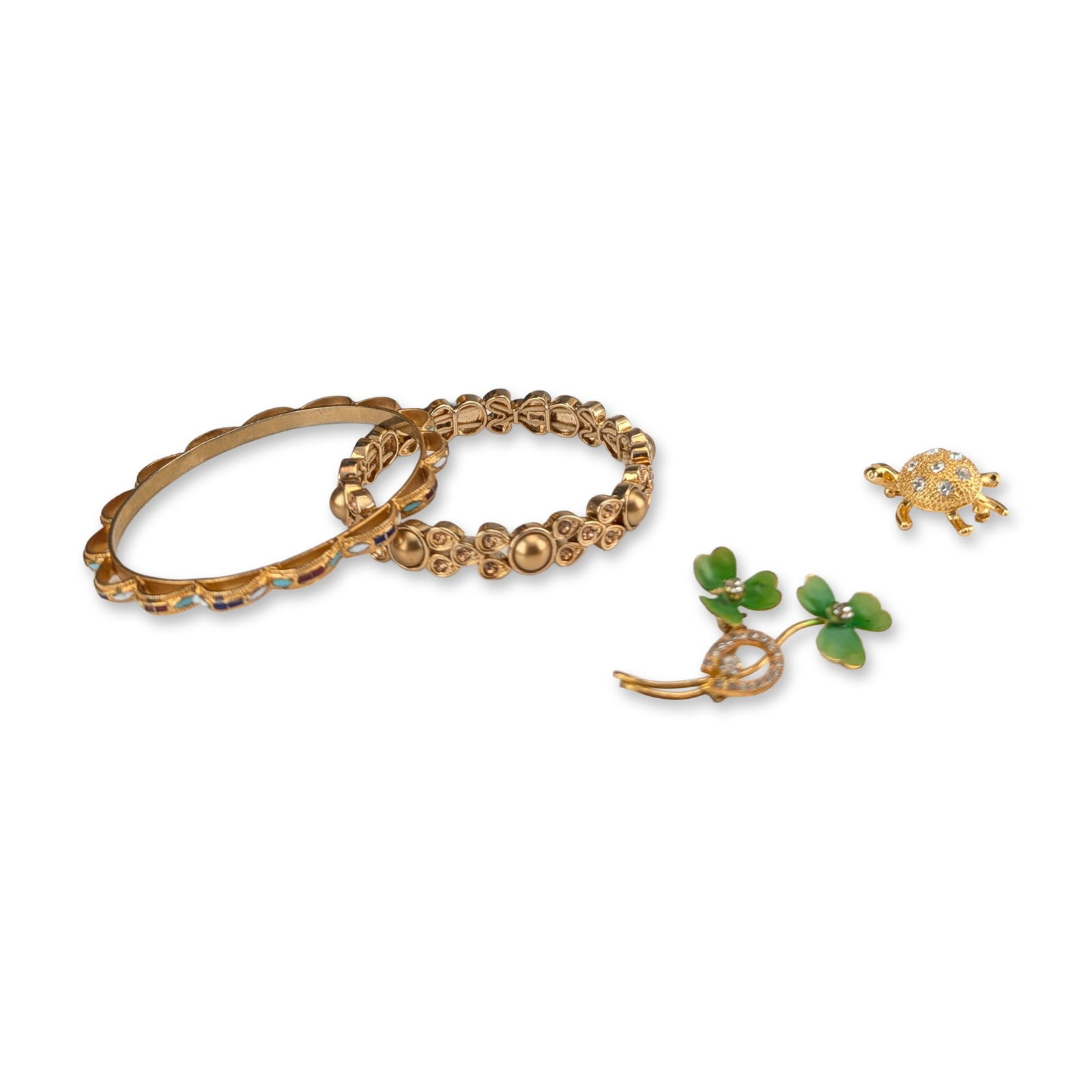 8pc Avon and Assorted Gold-Plated Costume Jewelry: Avon and assorted makers. An assortment of costume jewelry in gold-plated base metal, featuring a multi-strand wire cuff, a multi-strand link bracelet with white faux pearls, a scalloped bangle with r