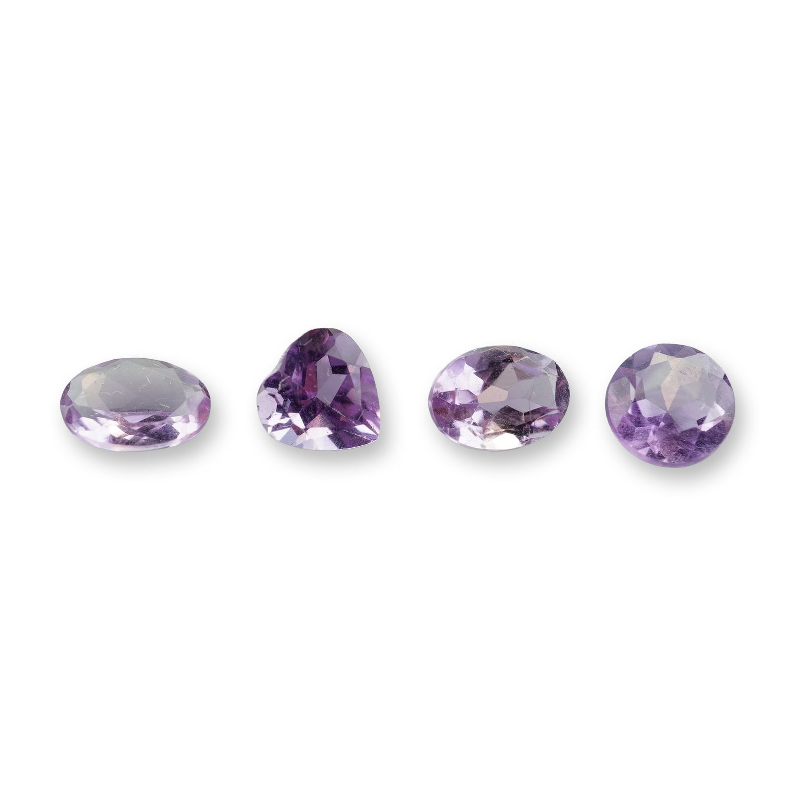 4pc Pink Amethyst Gemstones: Grouping of 4 pink amethyst gemstones in oval, heart and round shapes. Amethyst is the traditional birthstone for the month of February. it is best known for relieving stress, promoting restful