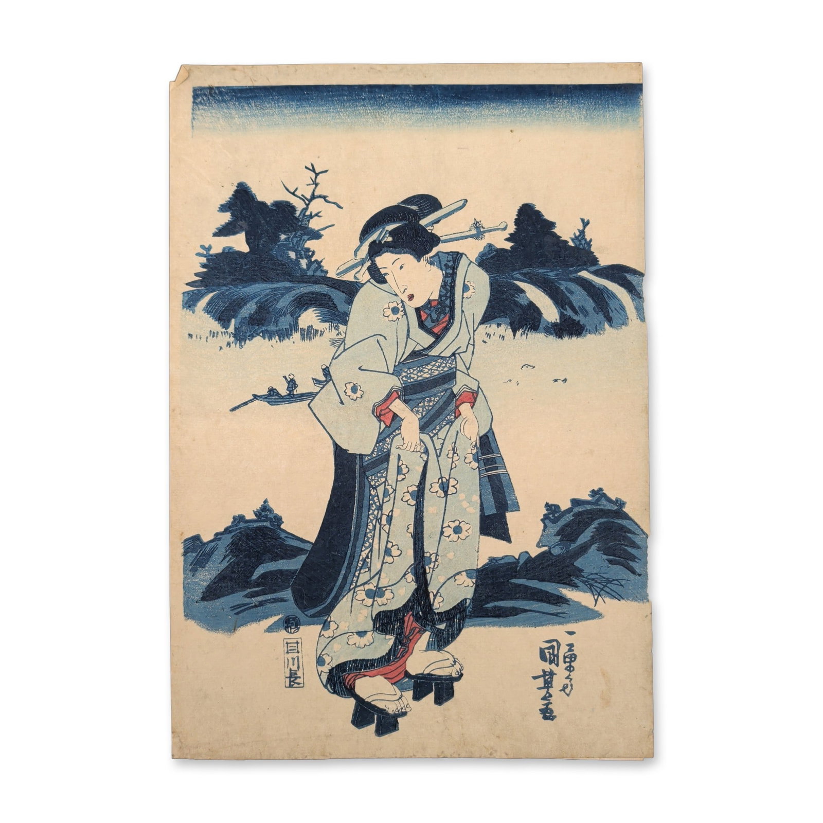 Utagawa Kuniyoshi (Japanese, 1797-1861) Favorite Customs of the Present Day Woodblock Print: A bijin stands on a riverbank, clutching the hemlines of her cherry-blossom and geometrically patterned robes upward as she walks along the shore. This Late Edo period composition relies on a primary