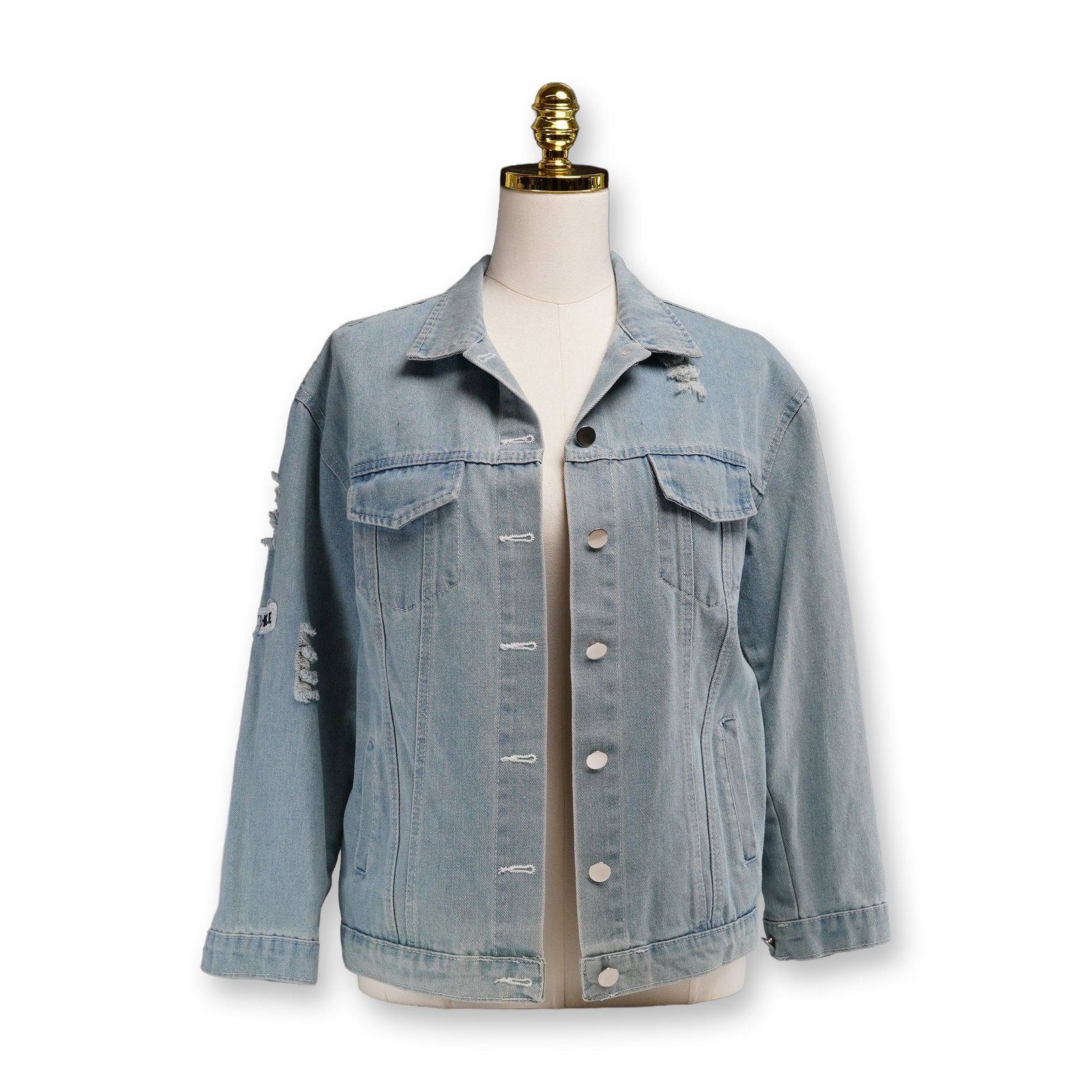 Ai Le Er Women's Jean Jacket from Holt Maison de Luxe, Where Is My Mind: Relaxed-fit distressed light blue denim jacket featuring embroidered Blackhole, 1987, and NYC patches. Designed with silver-tone button closures at the front, cuffs, and back adjusters. The reverse is