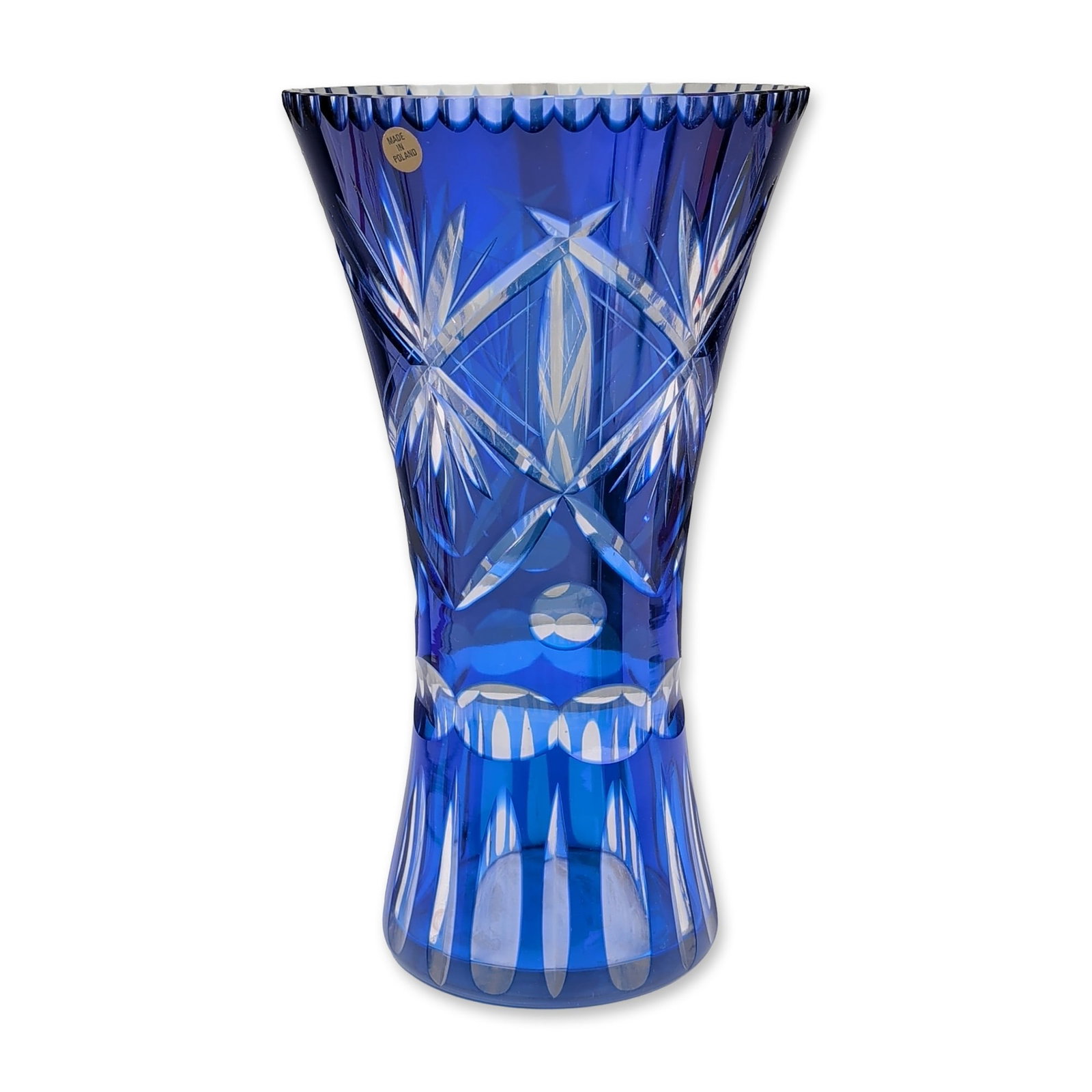 Polish Cobalt Cut to Clear Crystal Vase: A Polish hand-cut lead crystal vase in a flared trumpet form, featuring cobalt blue casing cut to a clear interior. The decorative program consists of large multi-point starburst motifs within a diamo