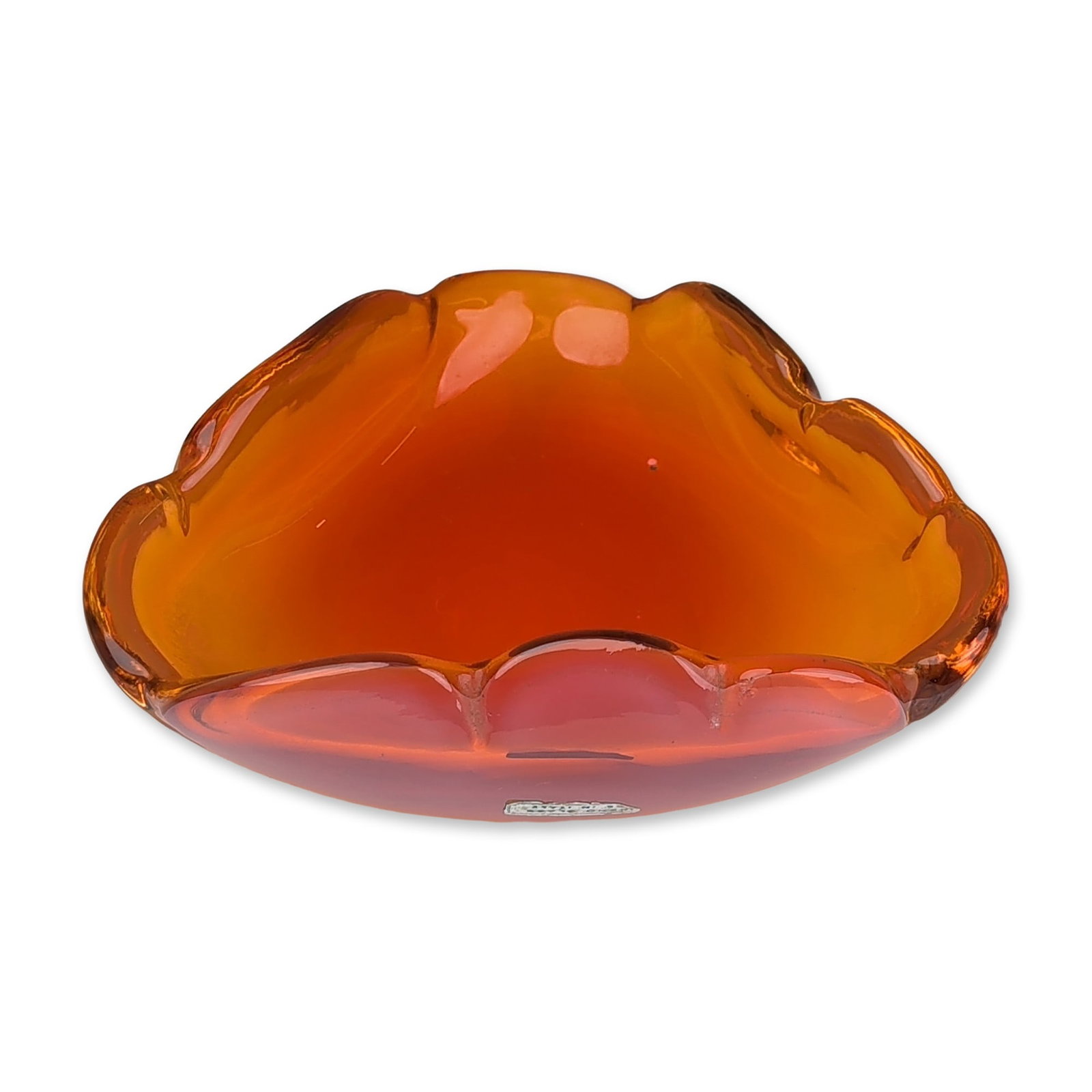 Murano Italian Amberina Cased Glass Bowl: Italian Murano art glass bowl in cased glass, featuring an organic trilobed form with a scalloped rim. The piece is constructed with a vibrant translucent orange interior encased in a pale pinkish-ora