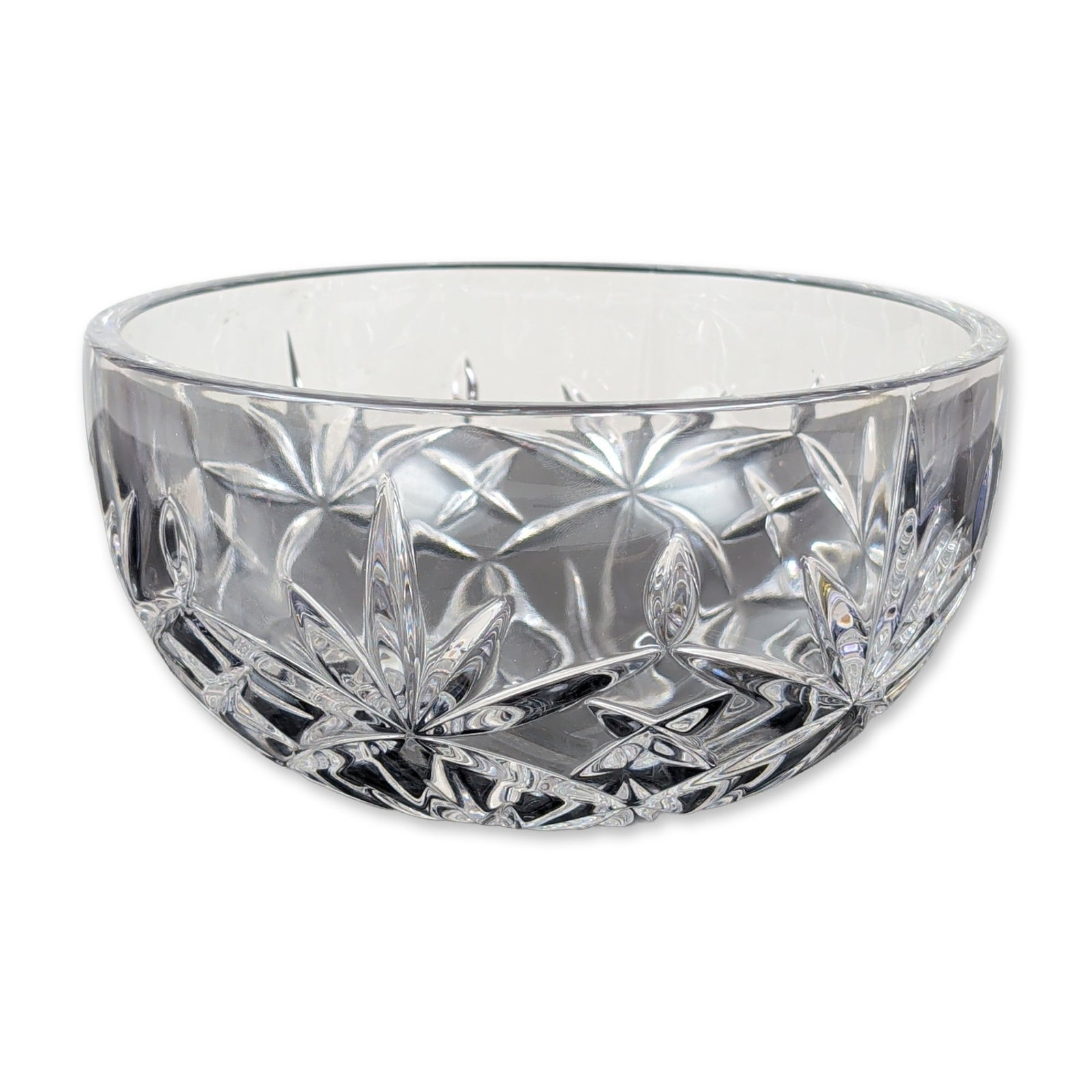Tiffany & Co. for Enterprise Cut Crystal Bowl: Tiffany & Co. cut crystal bowl featuring an intricate geometric pattern of large multi-pointed stars interspersed with four-pointed star motifs and deep linear miters. The clear lead crystal body is f