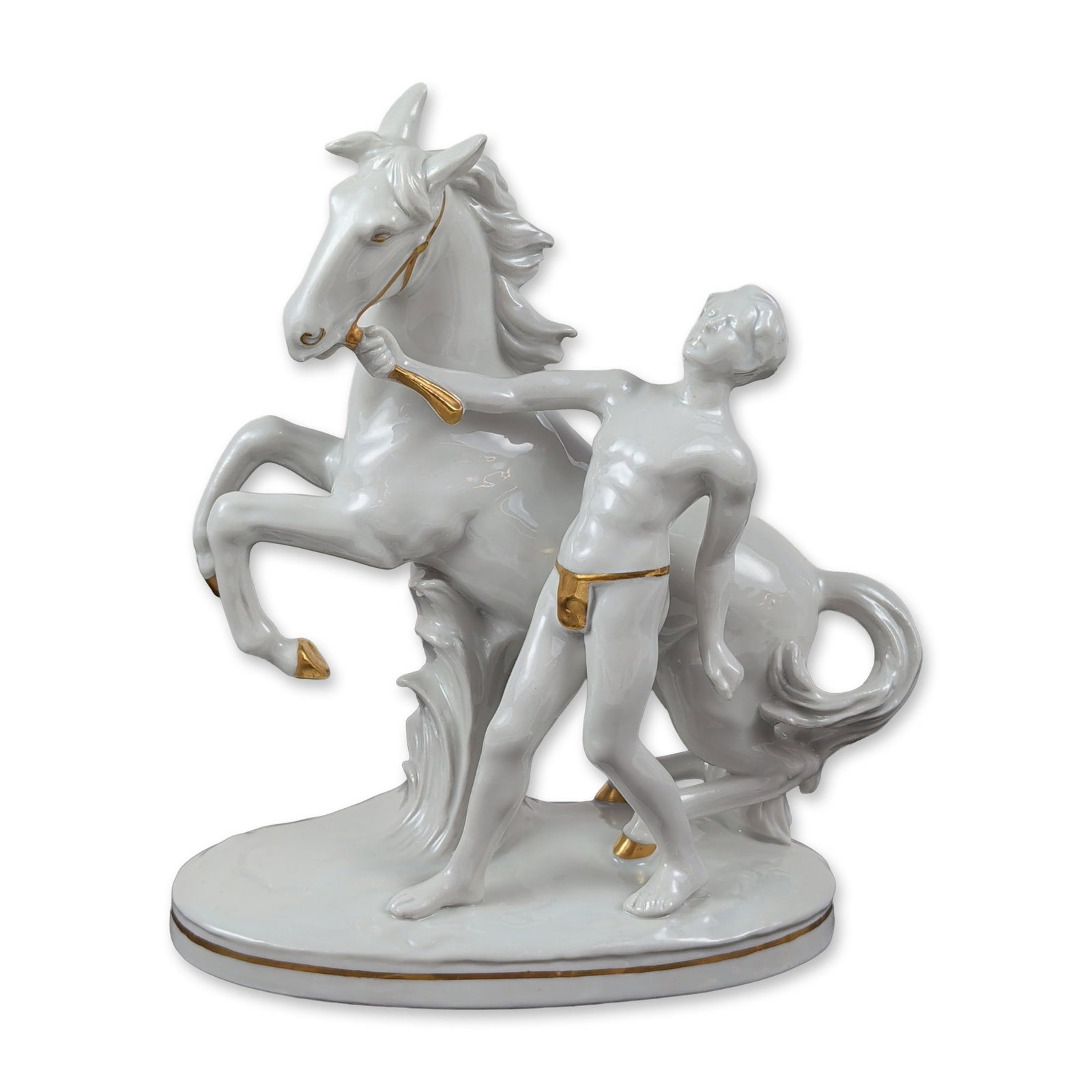 Carl Scheidig for Grafenthal Porcelain Figurine: Carl Scheidig for Grafenthal Germany glazed white porcelain figurine depicting a male figure in a loincloth restraining a rearing horse, with hand-applied gilt accents to the horse hooves and harness,