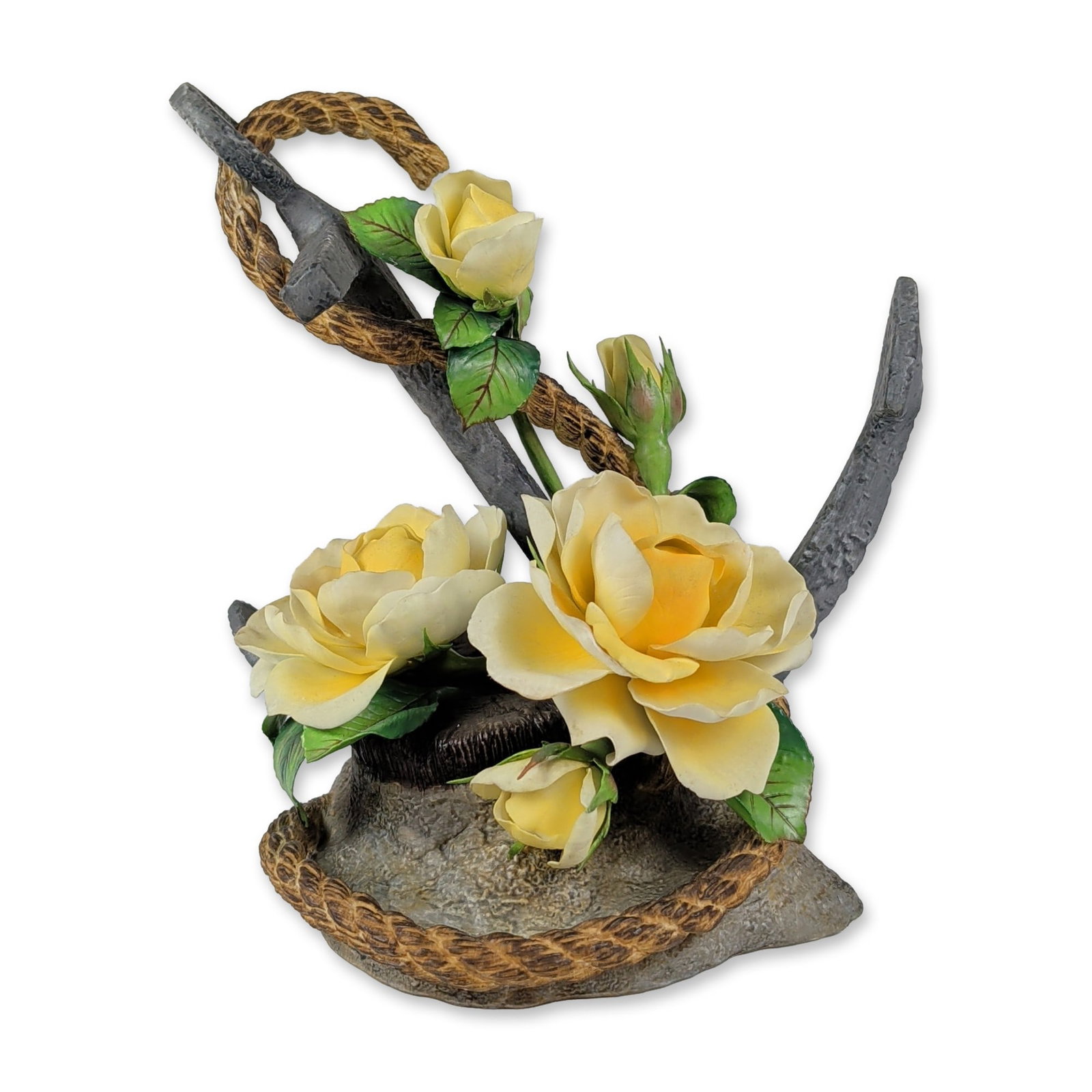 Limited Edition Boehm The Mountbatten Rose Porcelain Figurine: An English Boehm bone porcelain figurine titled The Mountbatten Rose, featuring a nautical anchor intertwined with a coiled rope and blooming yellow roses on a textured rocky base. The side of the bas