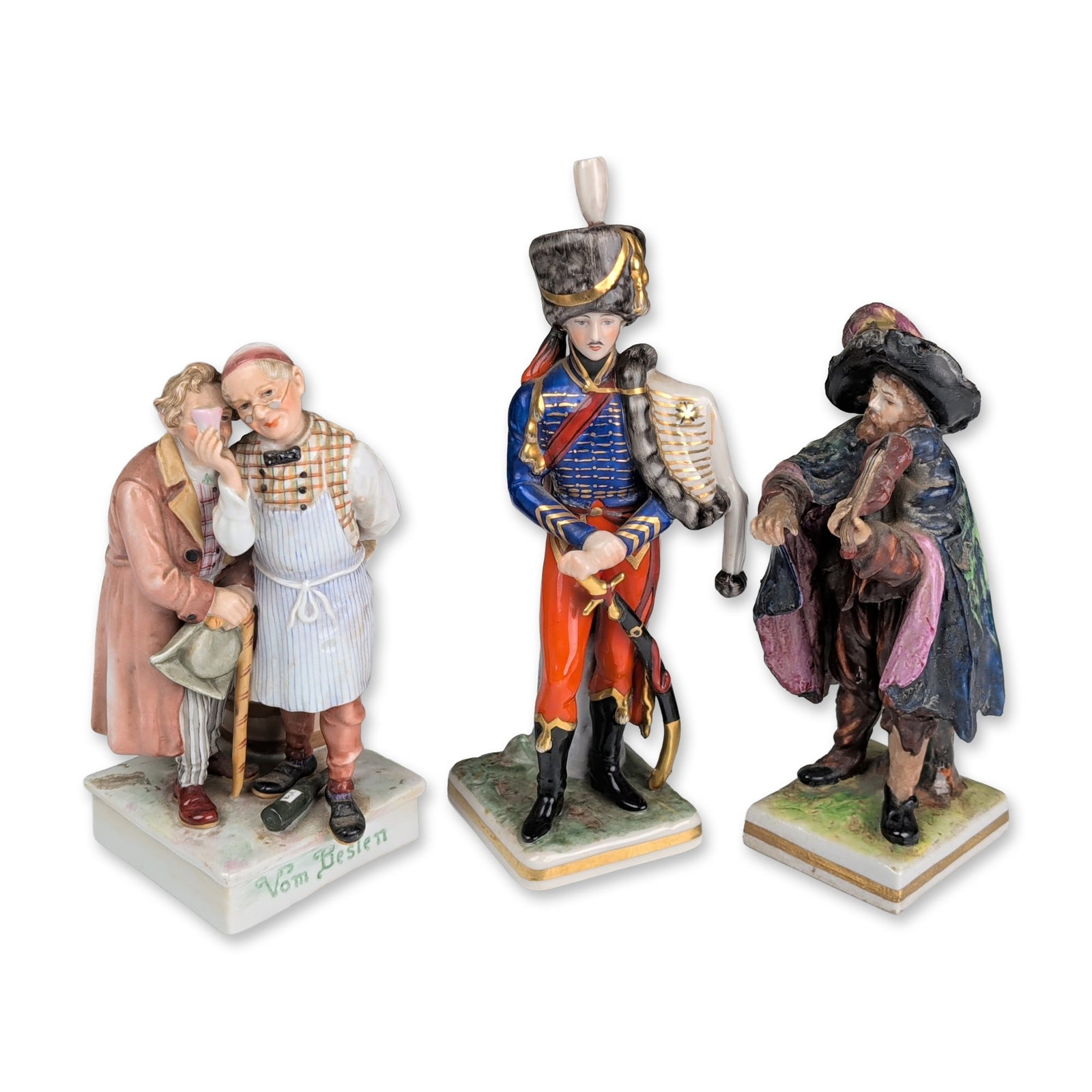3pc Capodimonte and German Hand-Painted Porcelain Figurines: German hand-painted glazed porcelain figurines, including a genre scene, a military officer, and a musician. The first figurine is titled Vom Besten in green script on the base front, depicting an inn