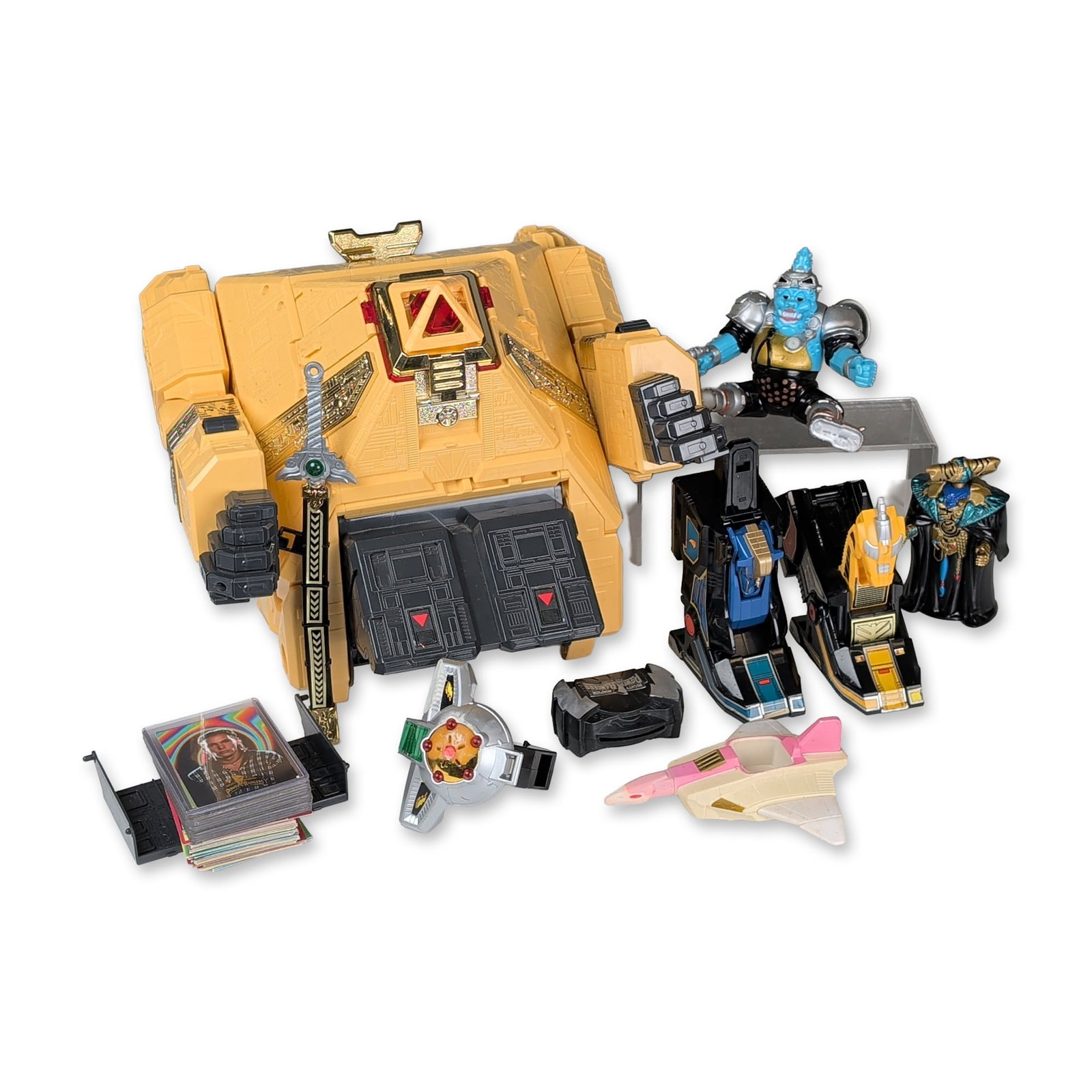 11pc Collection of Power Rangers Zeo and MMPR Toys: Collection of vintage Power Rangers toys and collectibles, including pieces from the Zeo and Mighty Morphin Power Rangers series. The lot contains a large yellow plastic Pyramidas Carrier Zord with go