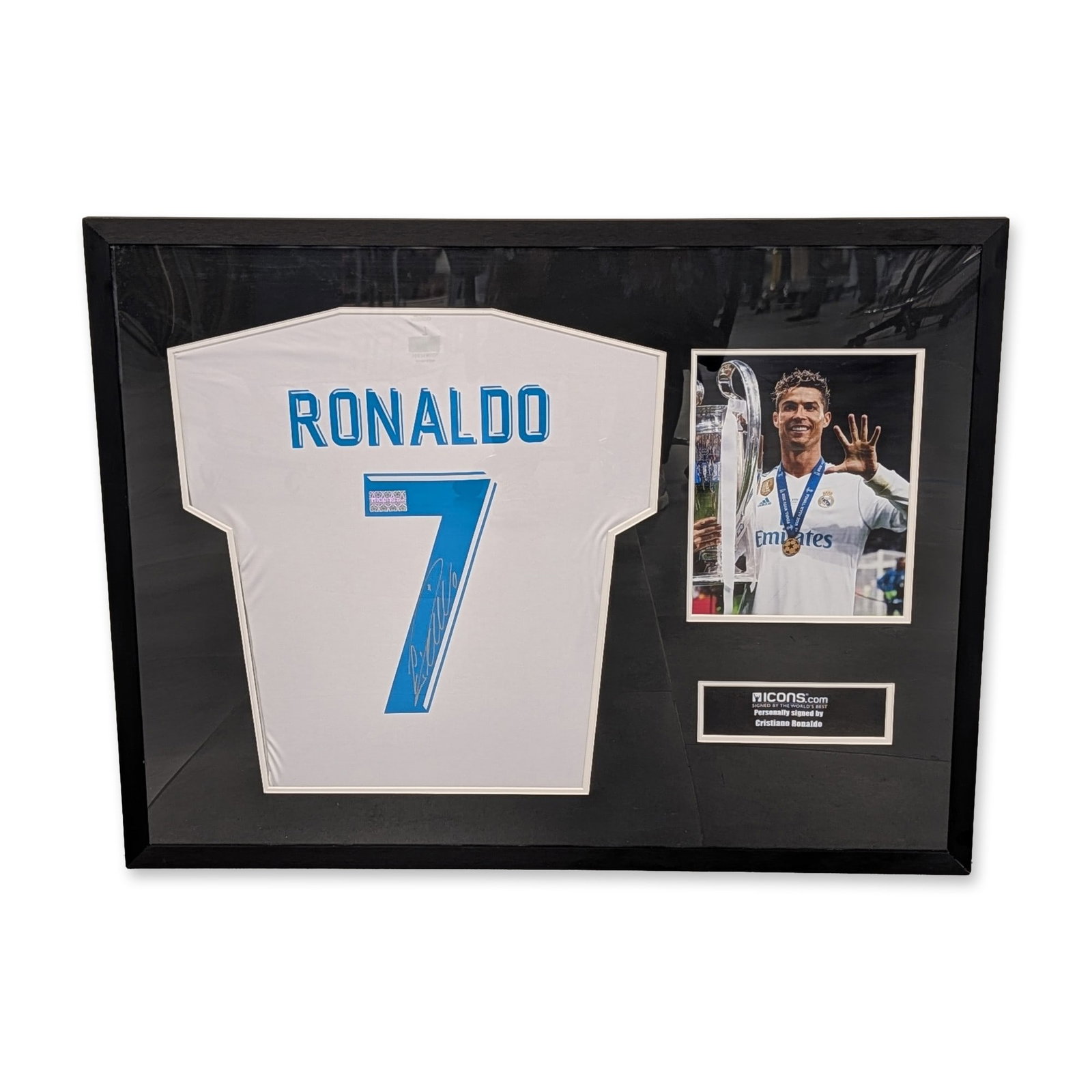 Cristiano Ronaldo Signed Real Madrid Home Shirt w/ COA: Real Madrid C.F. 2017-18 home jersey signed by Cristiano Ronaldo. The jersey displays the player name RONALDO and number 7 in blue, with a signature in silver ink on the numeral. A small rectangular h
