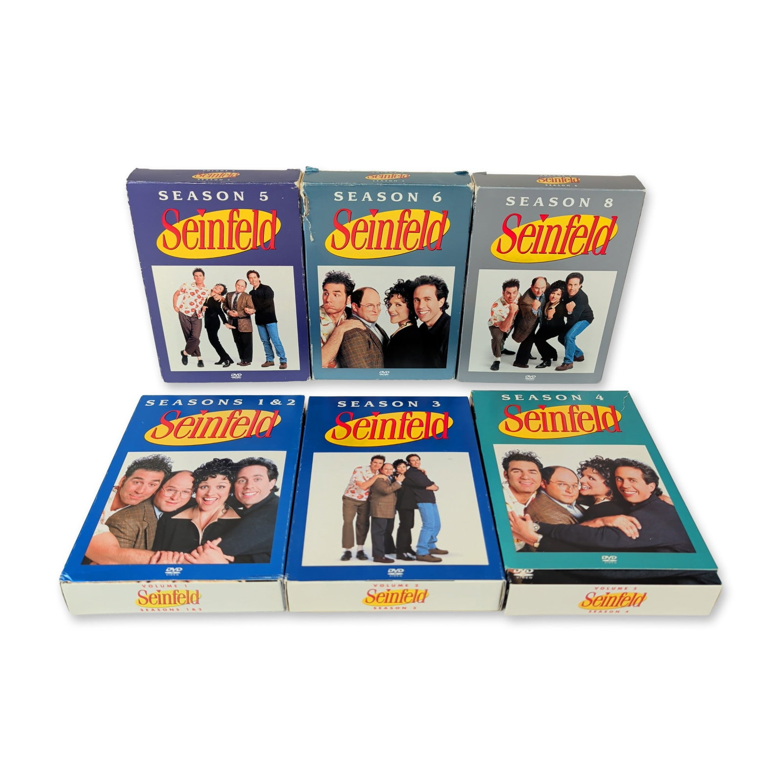 6pc Seinfeld DVD Box Sets: This collection of home video releases features multiple seasonal volumes from the television comedy series franchise. The assortment comprises six individual multi-disc box sets spanning seasons one 