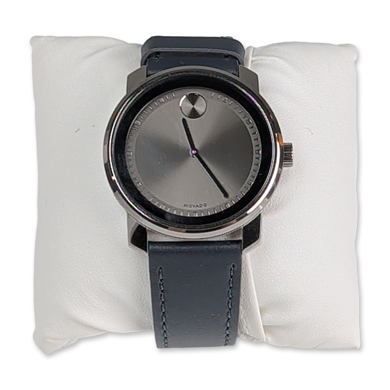 Movado Bold Grey Dial Leather Wrist Watch: Movado Bold wrist watch featuring a gunmetal-tone ion-plated stainless steel case and a black leather strap with grey contrast stitching. The grey sunray dial is designed with a silver-toned textured 