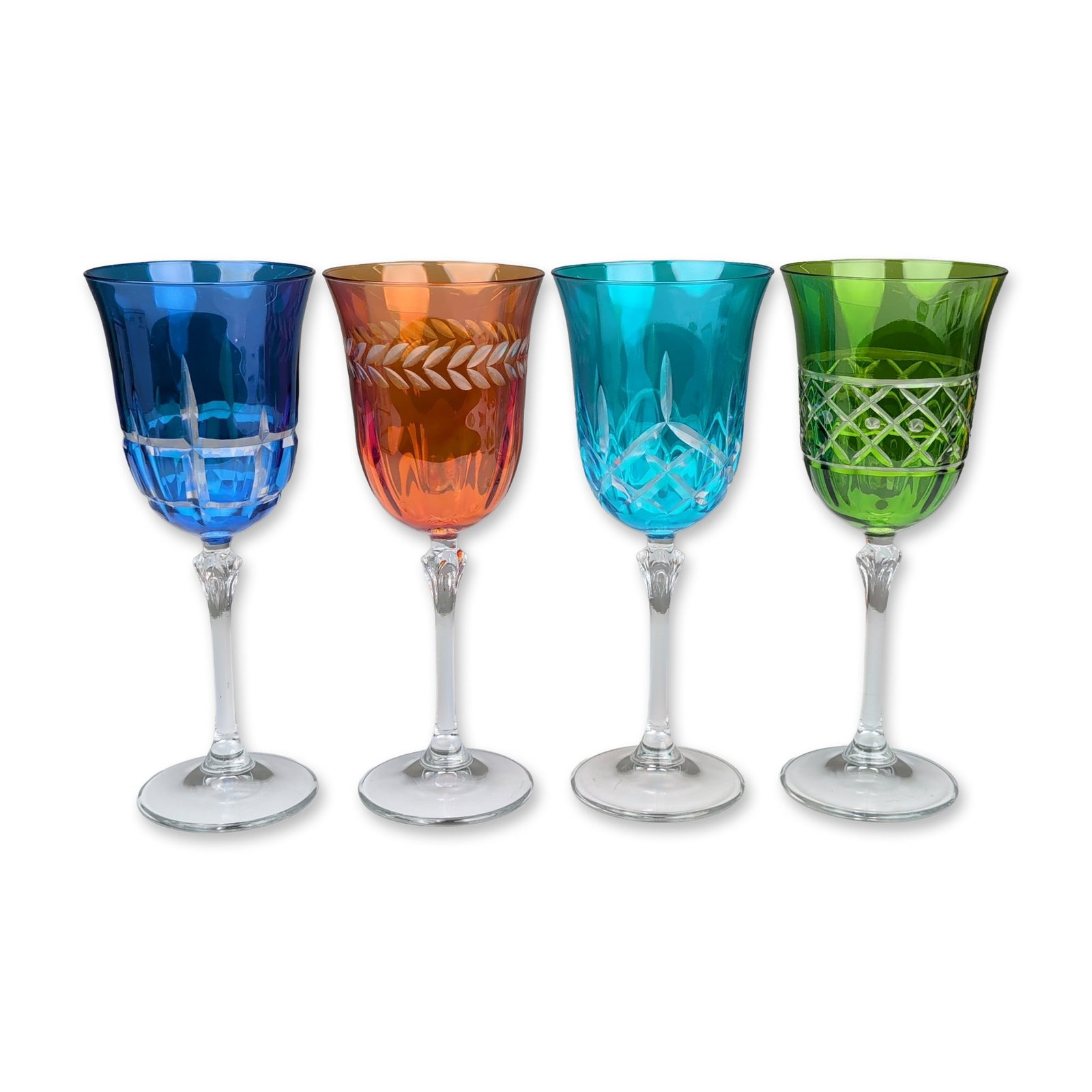 Set of Four Multicolored Cased Crystal Goblets: Set of four cased-to-clear crystal wine or water goblets in a harlequin color scheme. The set includes bowls in cobalt blue, amber, turquoise, and emerald green, each featuring a distinct hand-cut